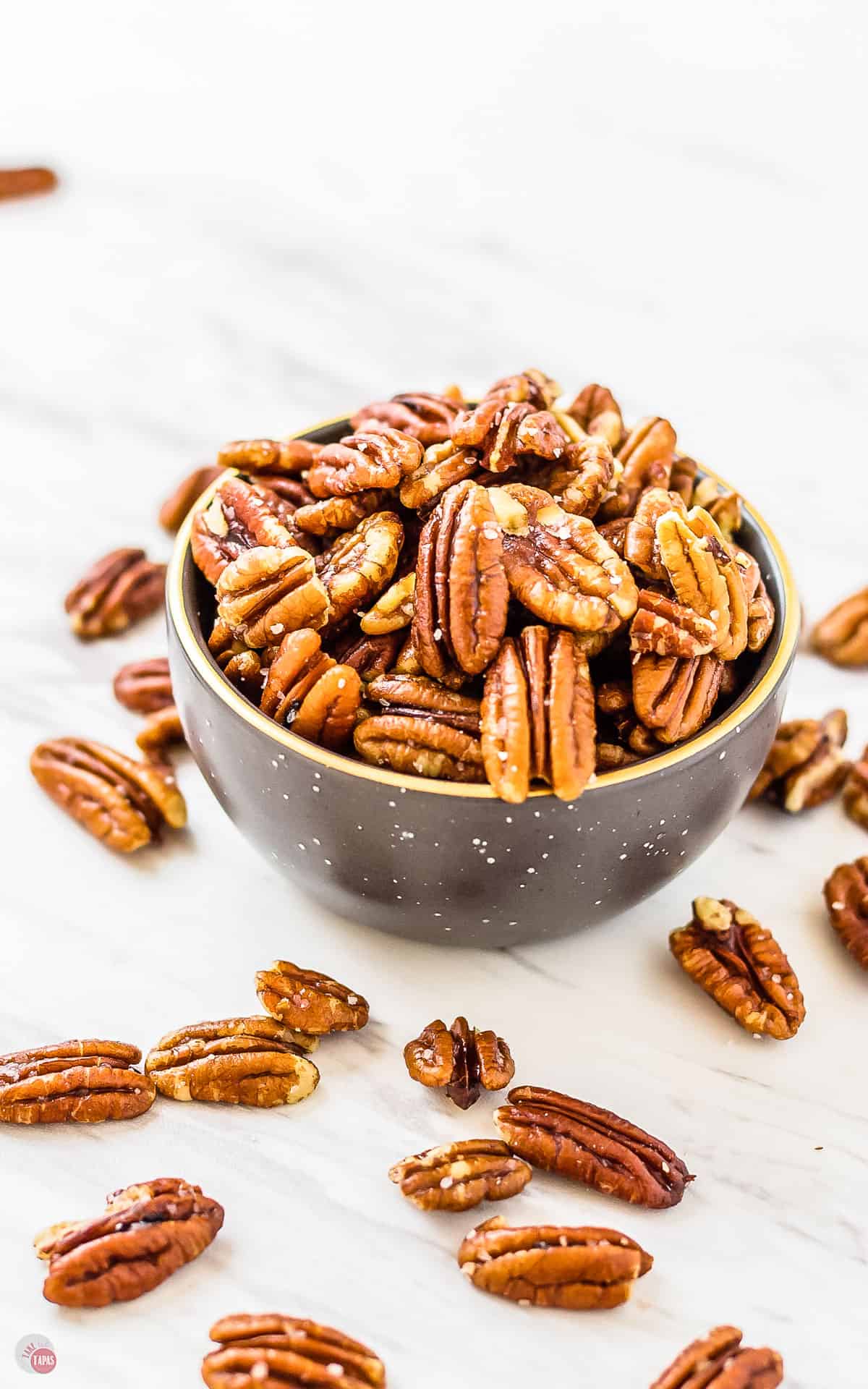 A small bowl of toasted pecans