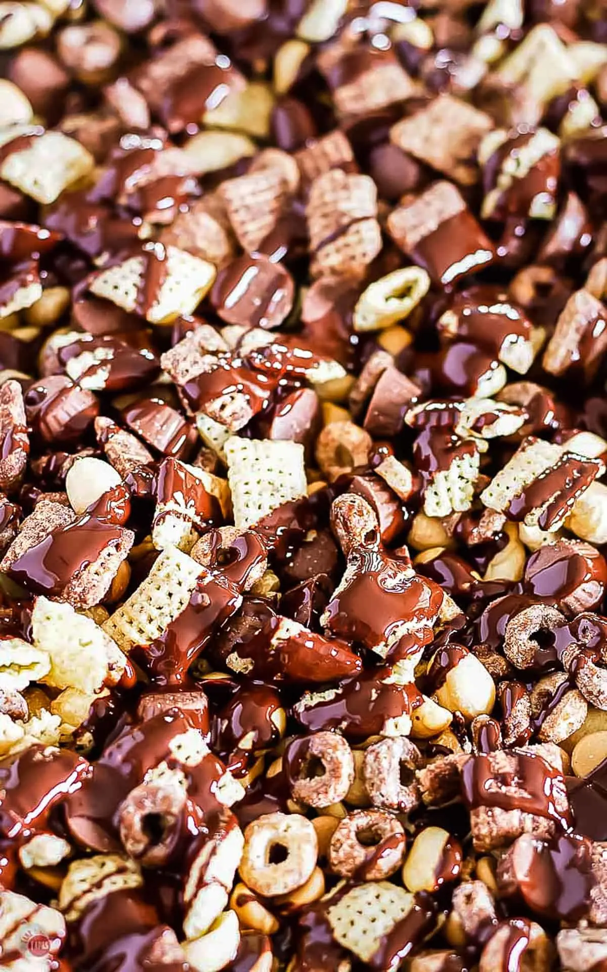 close up of drizzled chocolate on Buckeye Snack Mix