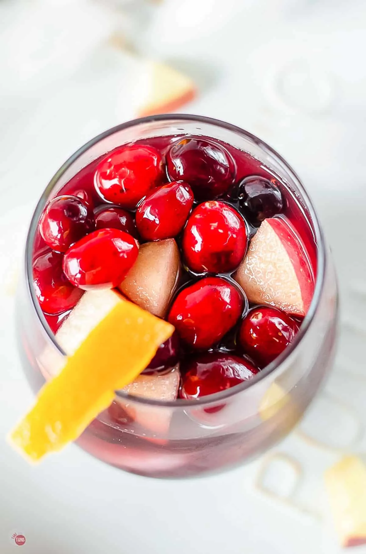 close up of top of cranberry sangria glass