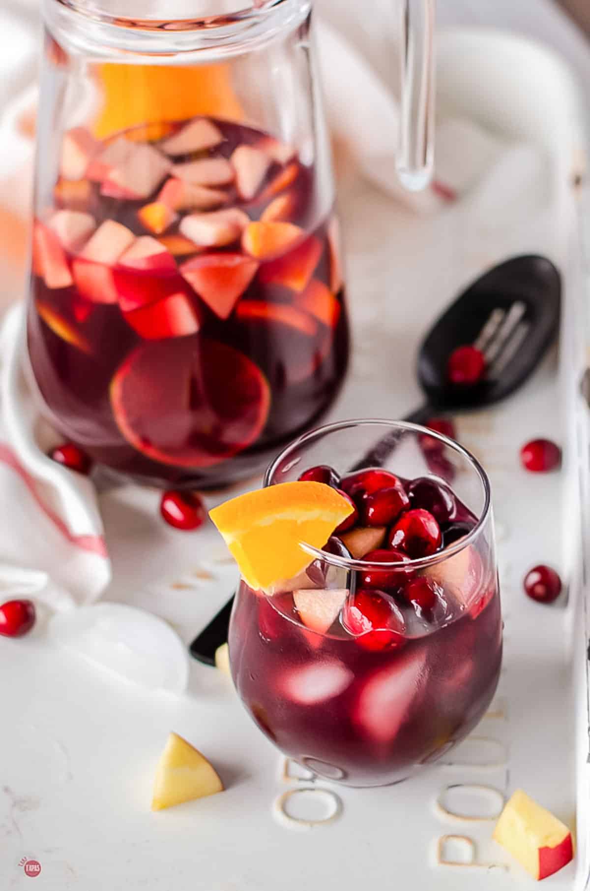 pitcher of sangria with glass