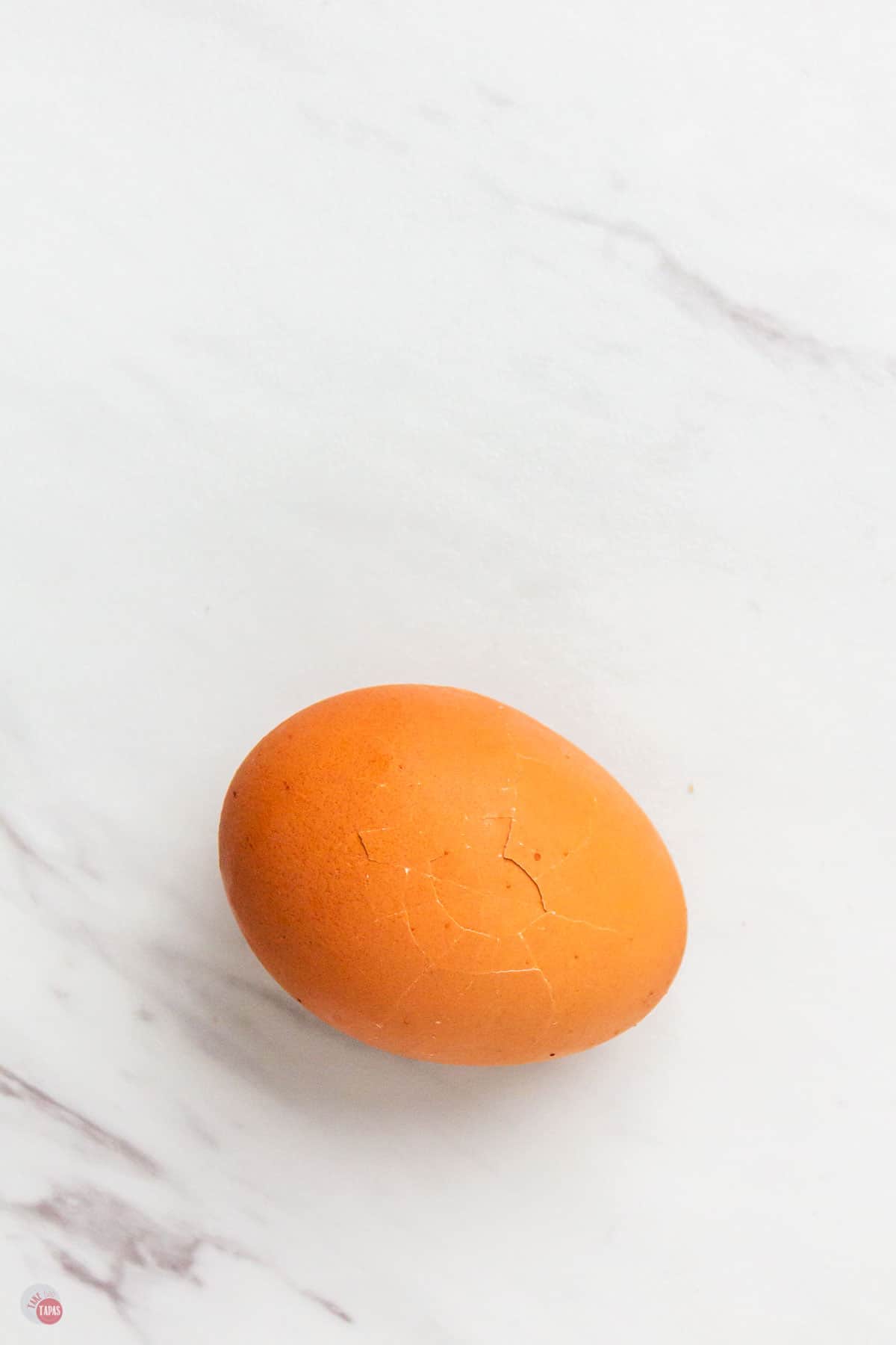 overhead picture of cracked hard boiled egg