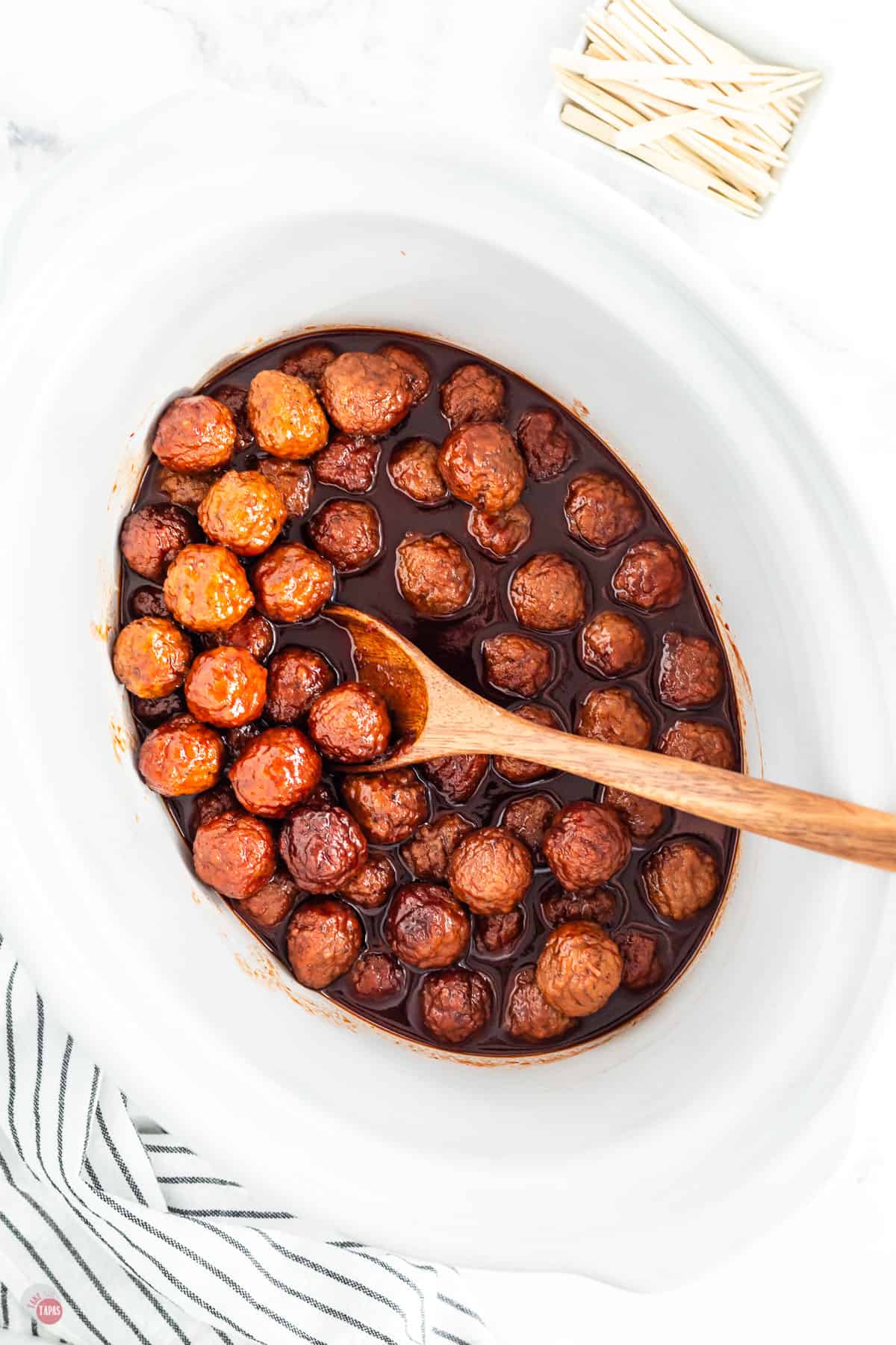 grape jelly meatballs in a white slow cooker