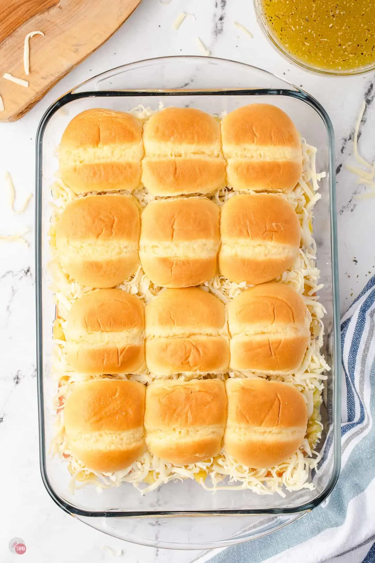 unbaked sliders in a pan