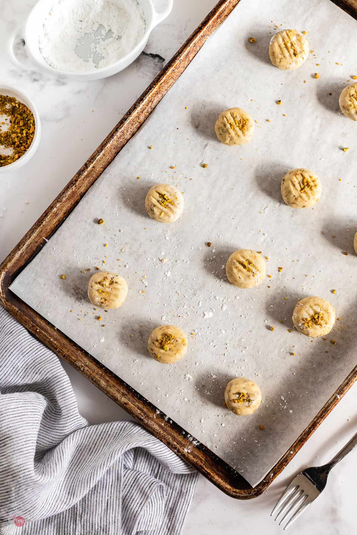 cookie dough balls on a baking sheet