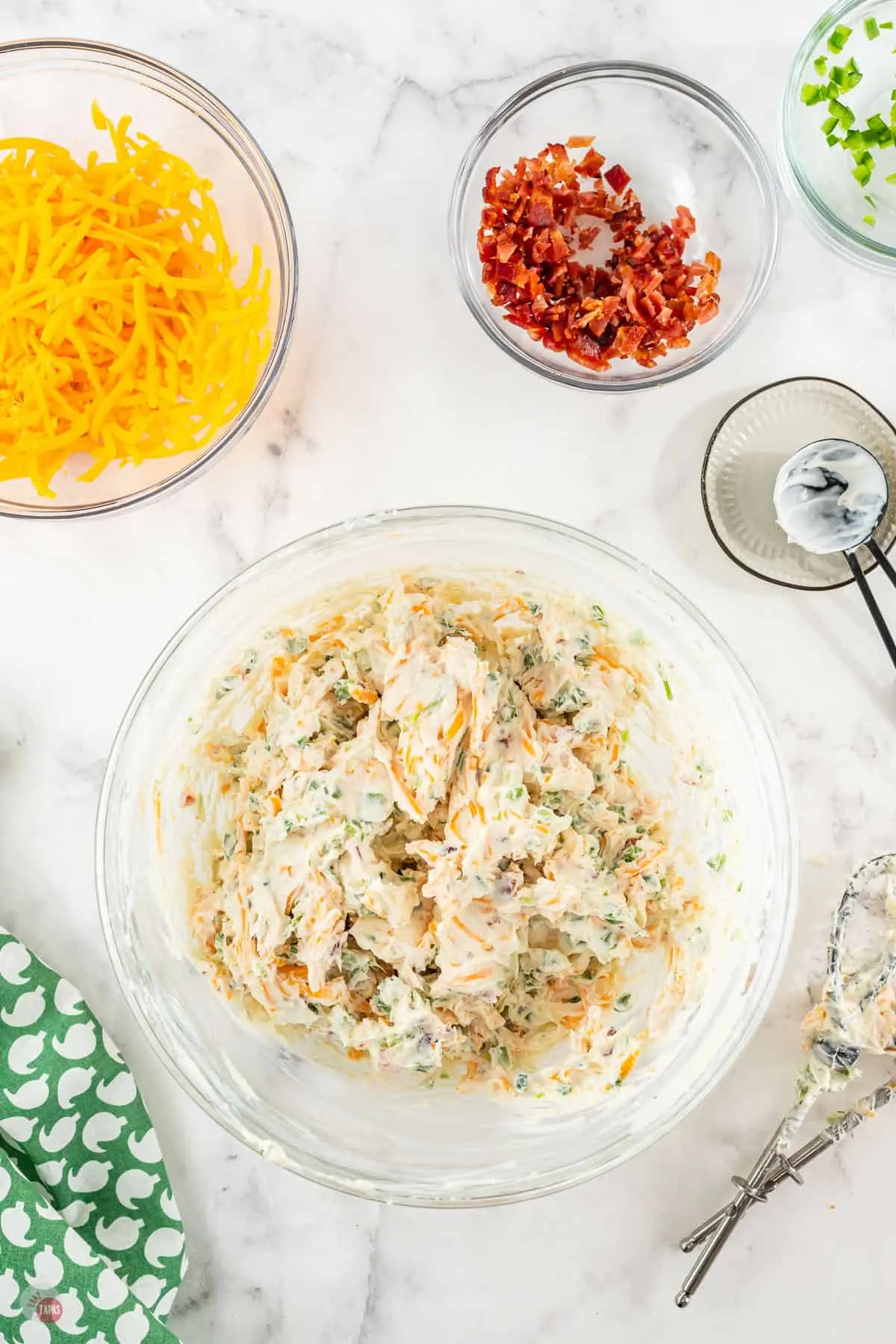 unformed cheese ball in a bowl