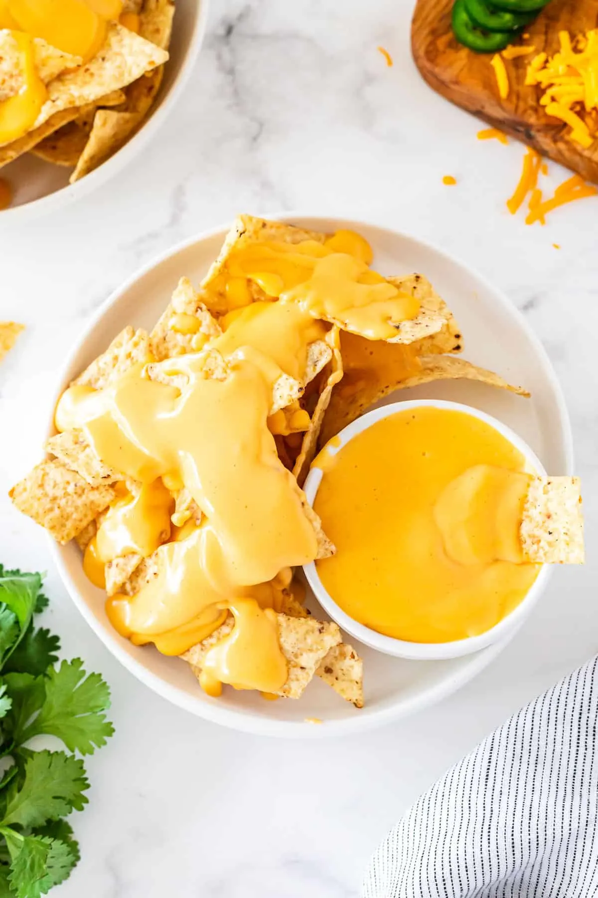 bowl of chips and cheese sauce