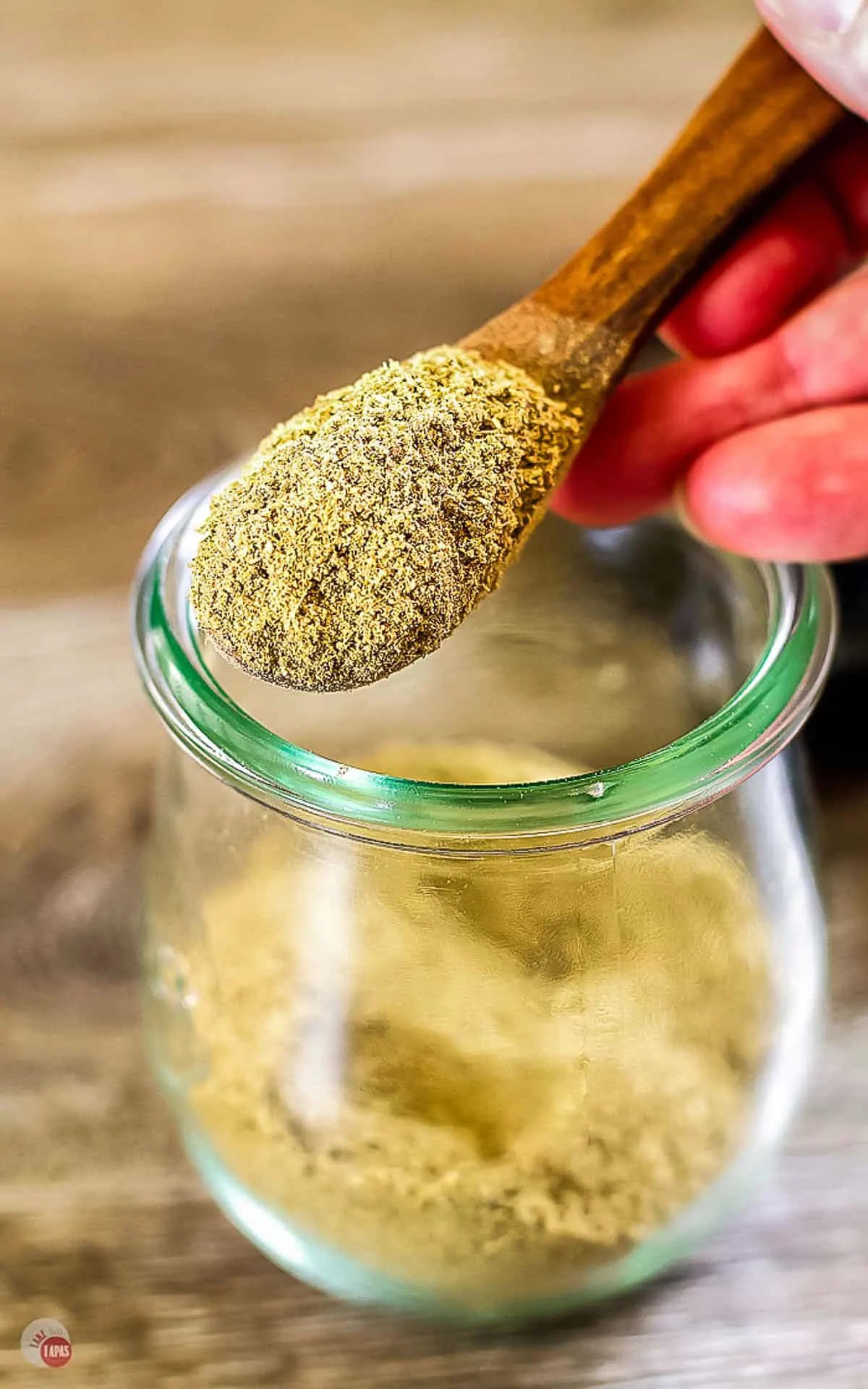 overhead picture of seasoning in a wooden spoon
