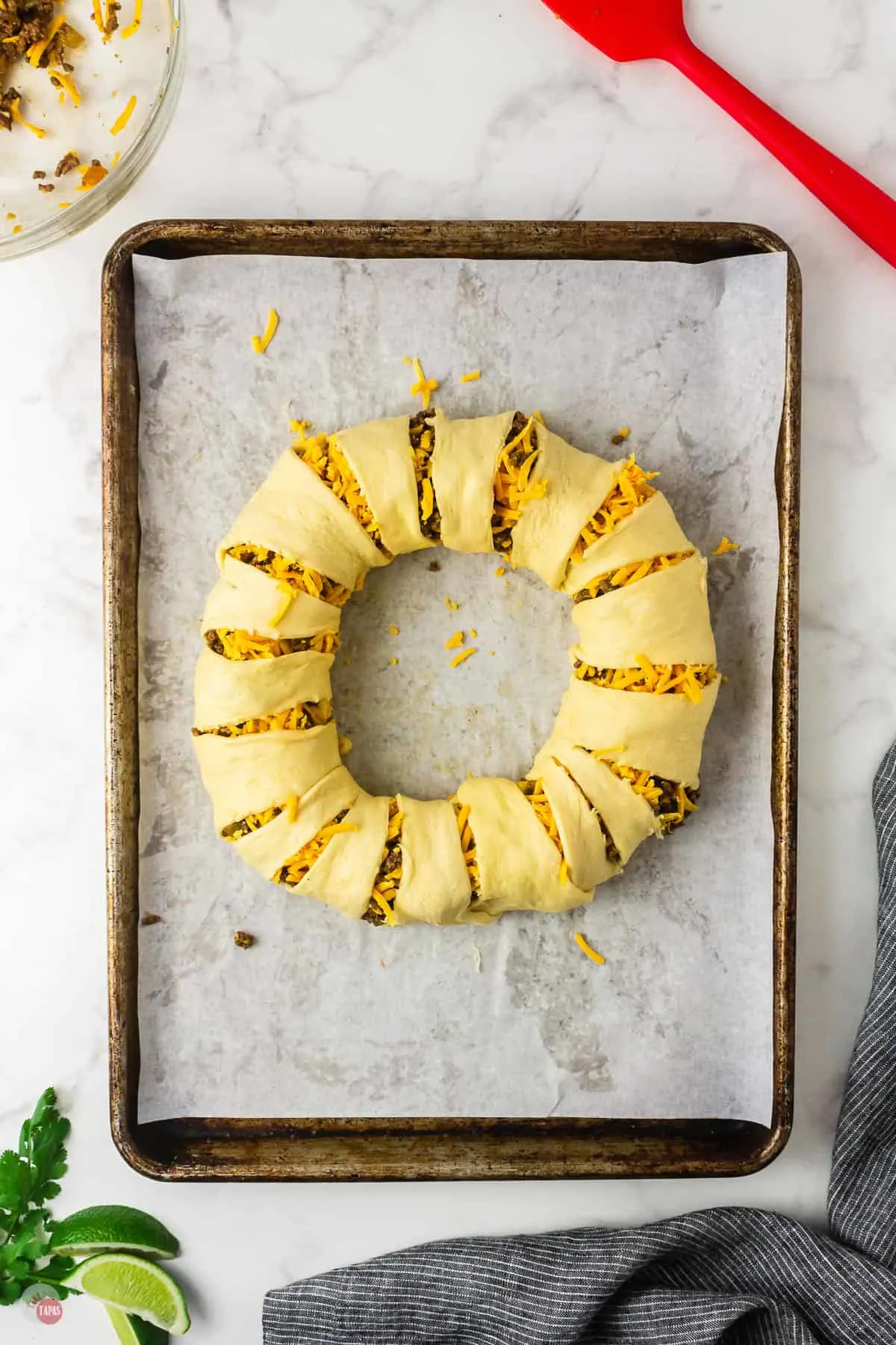 uncooked taco ring on baking sheet