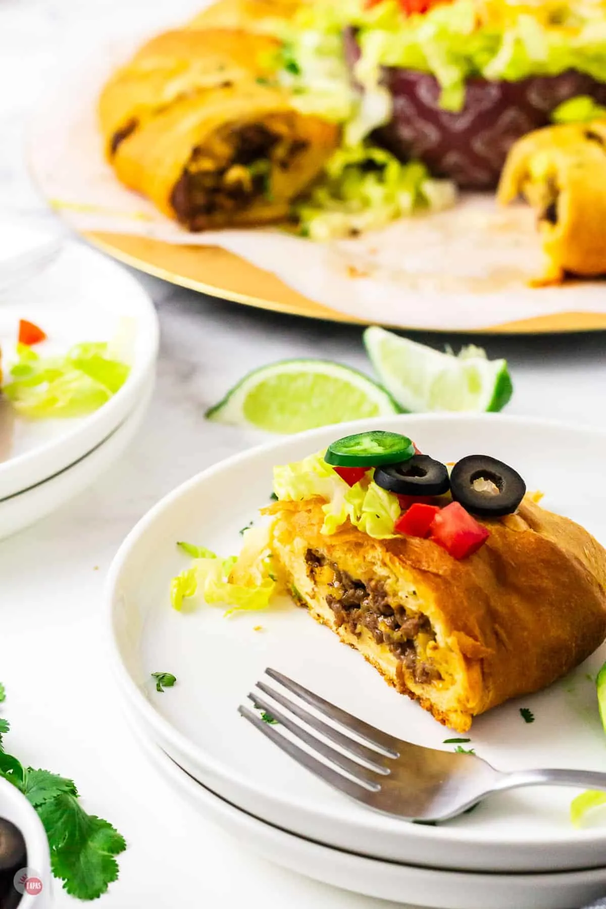 two plates of crescent roll taco bake slices