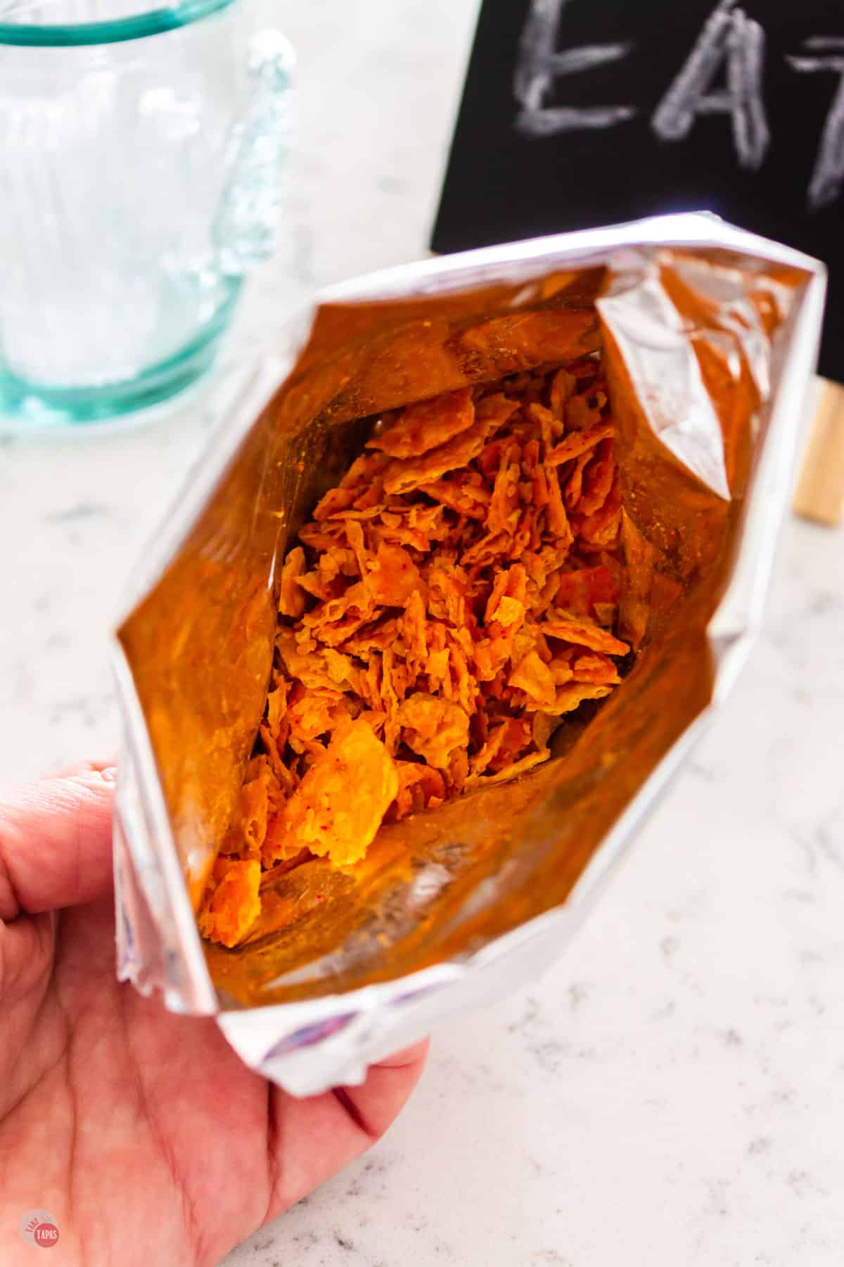 crumbled up chips in a bag