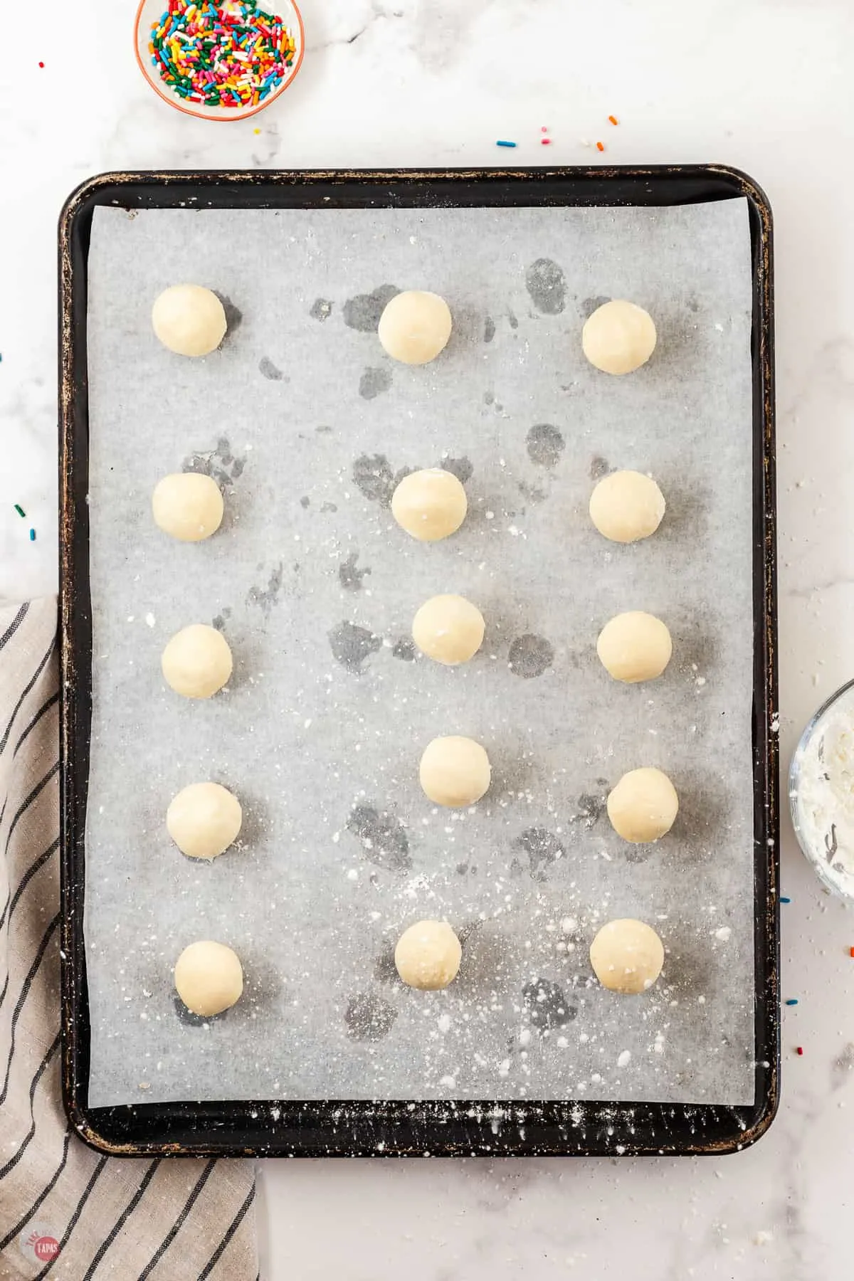 dough balls on a baking sheet