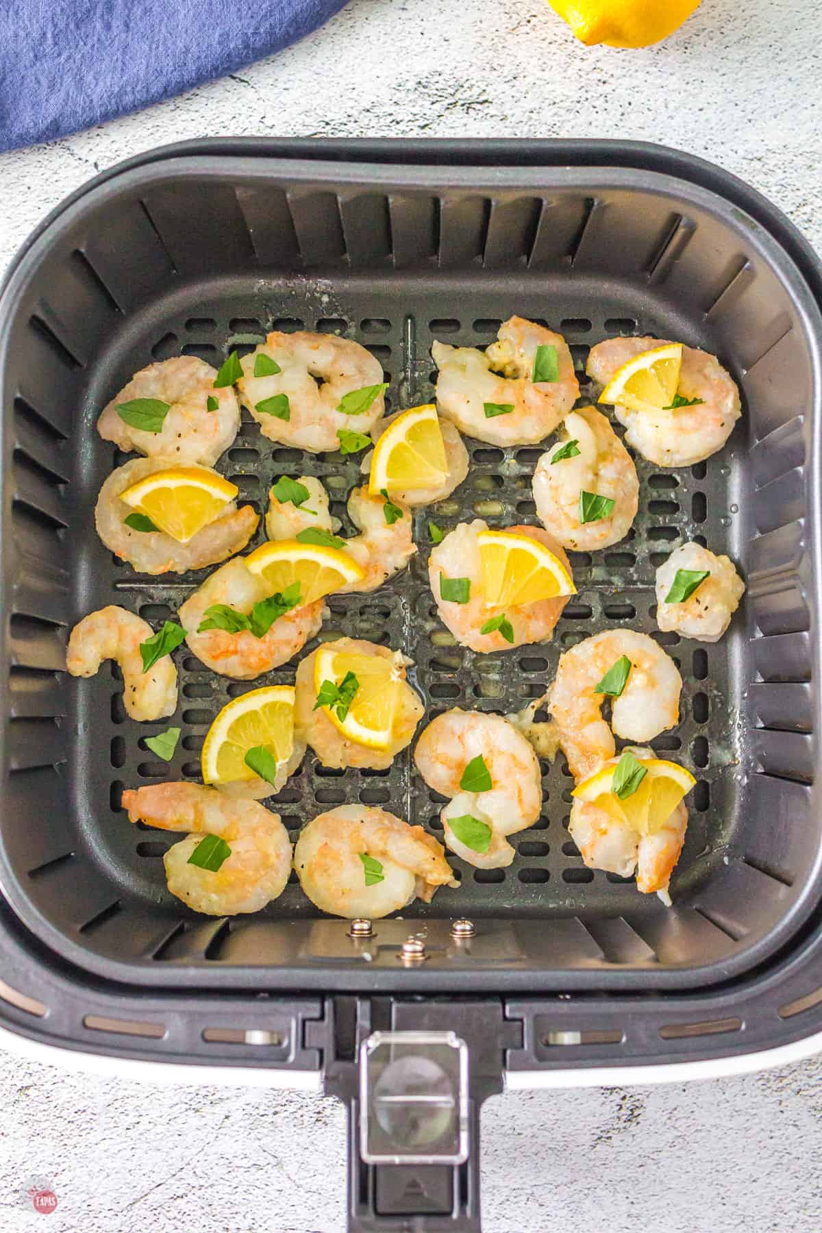 shrimp and lemons in basket