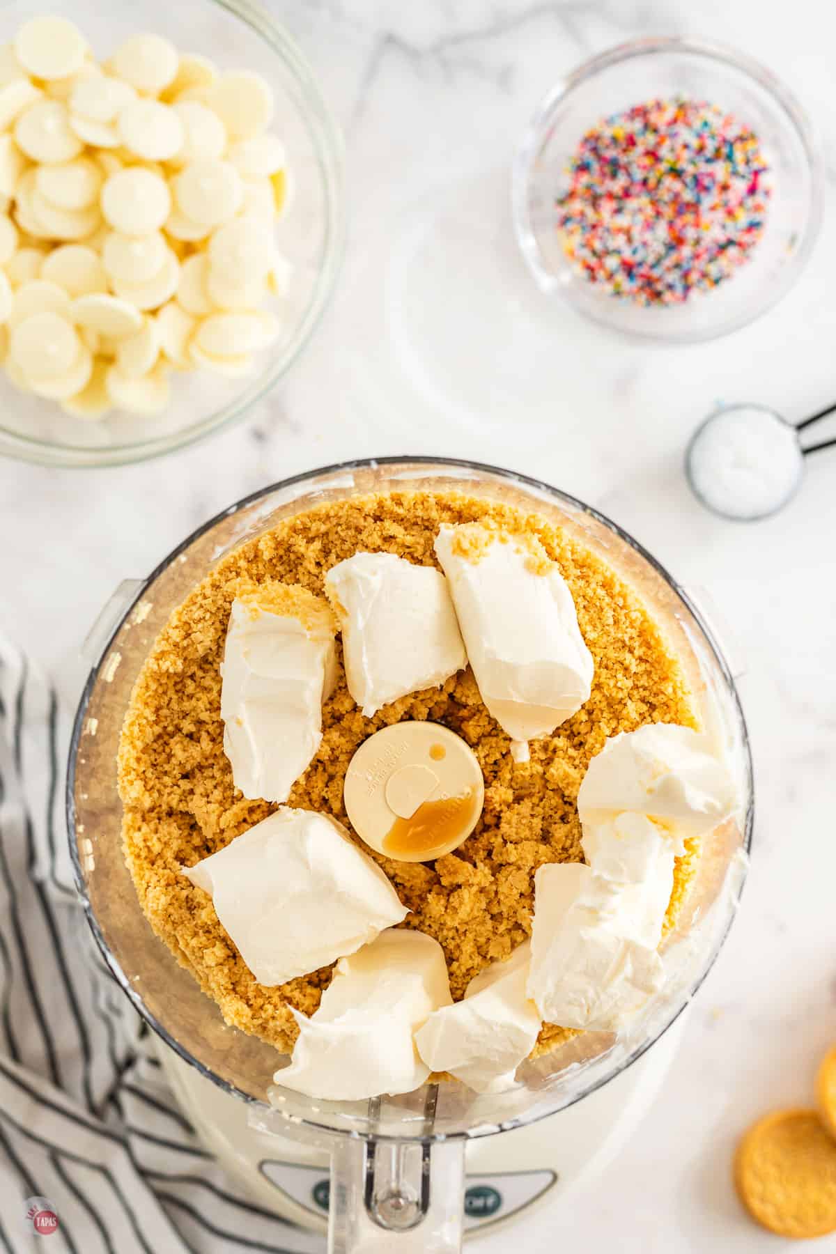 cookie crumbs and cream cheese in a food processor