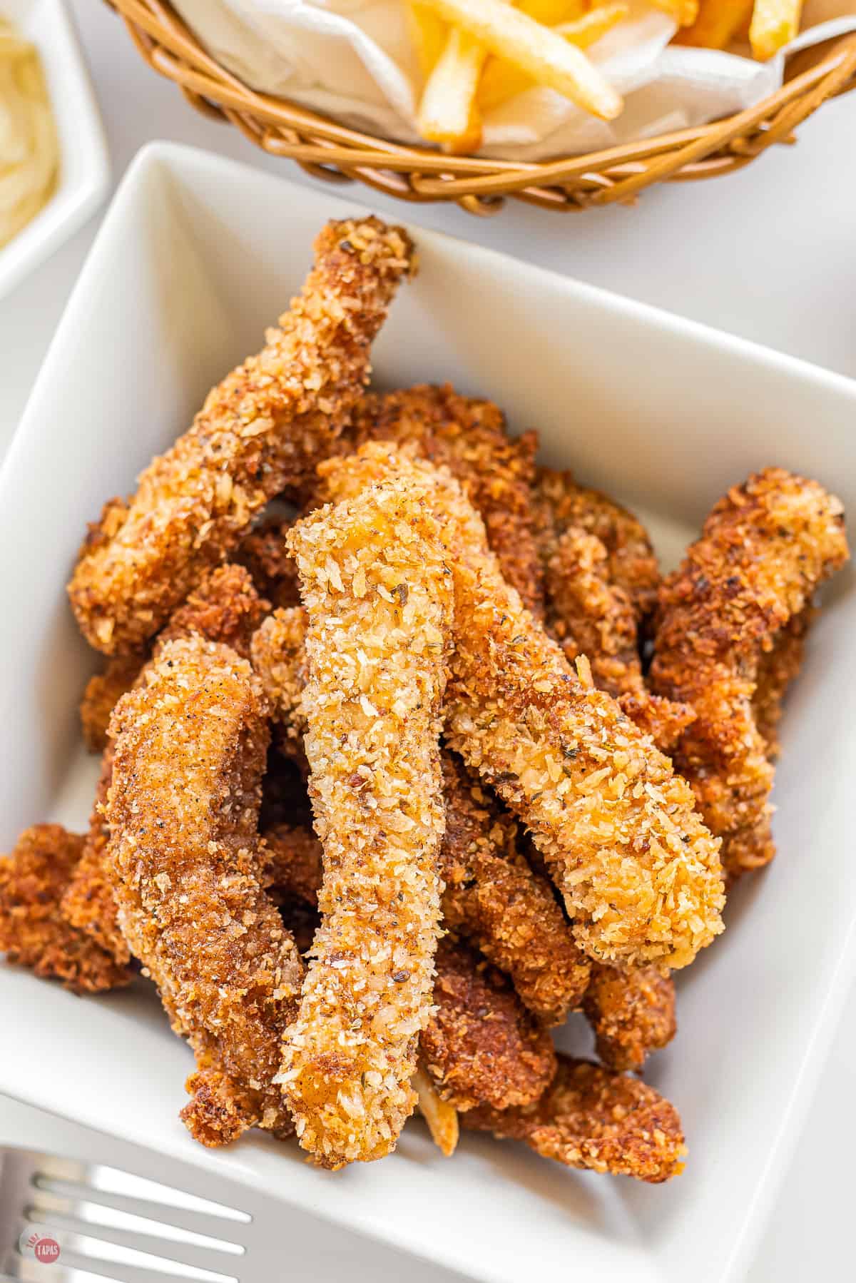 white square bowl with air fryer fish sticks