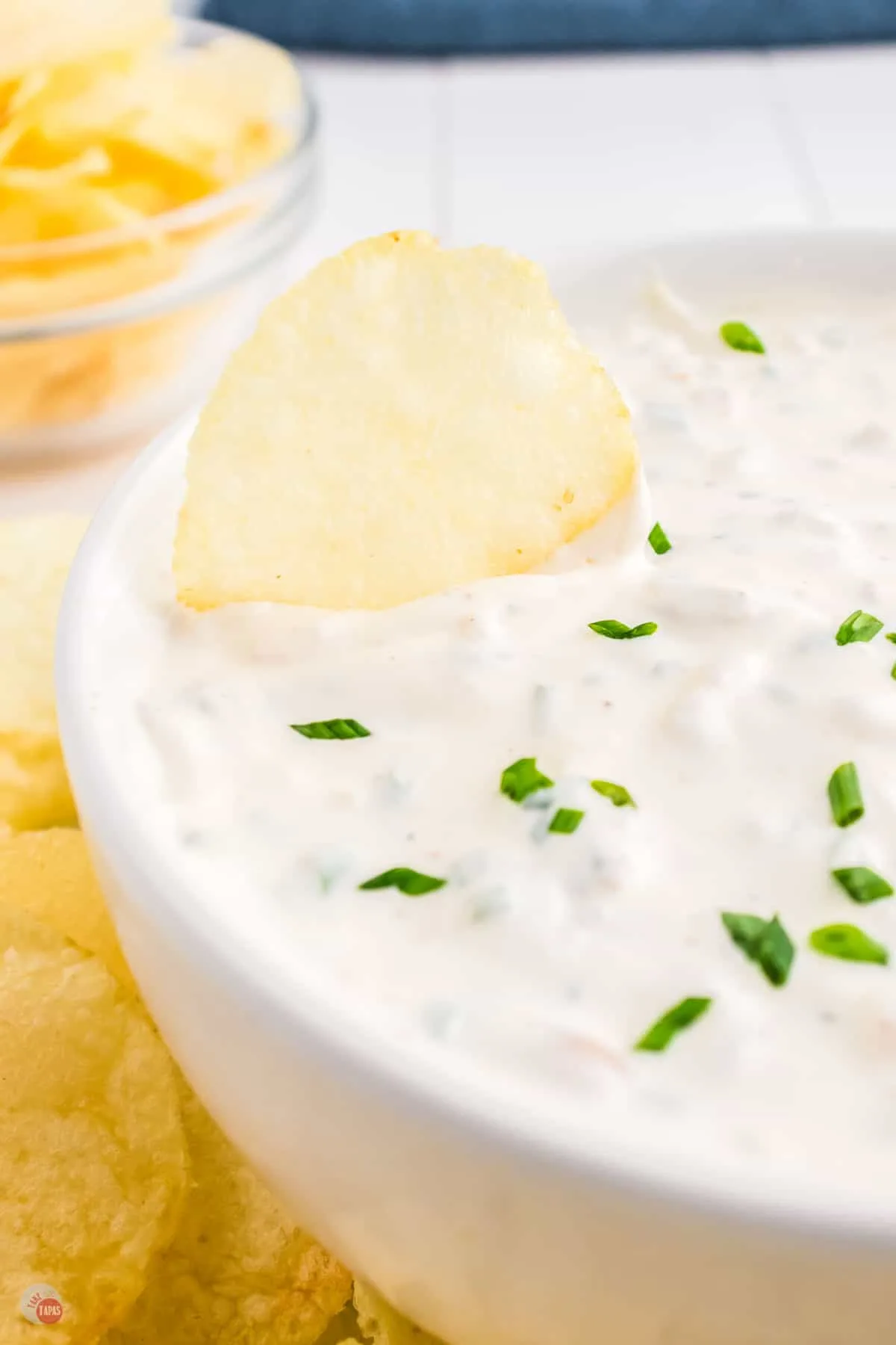 close up of bowl of dip with chip