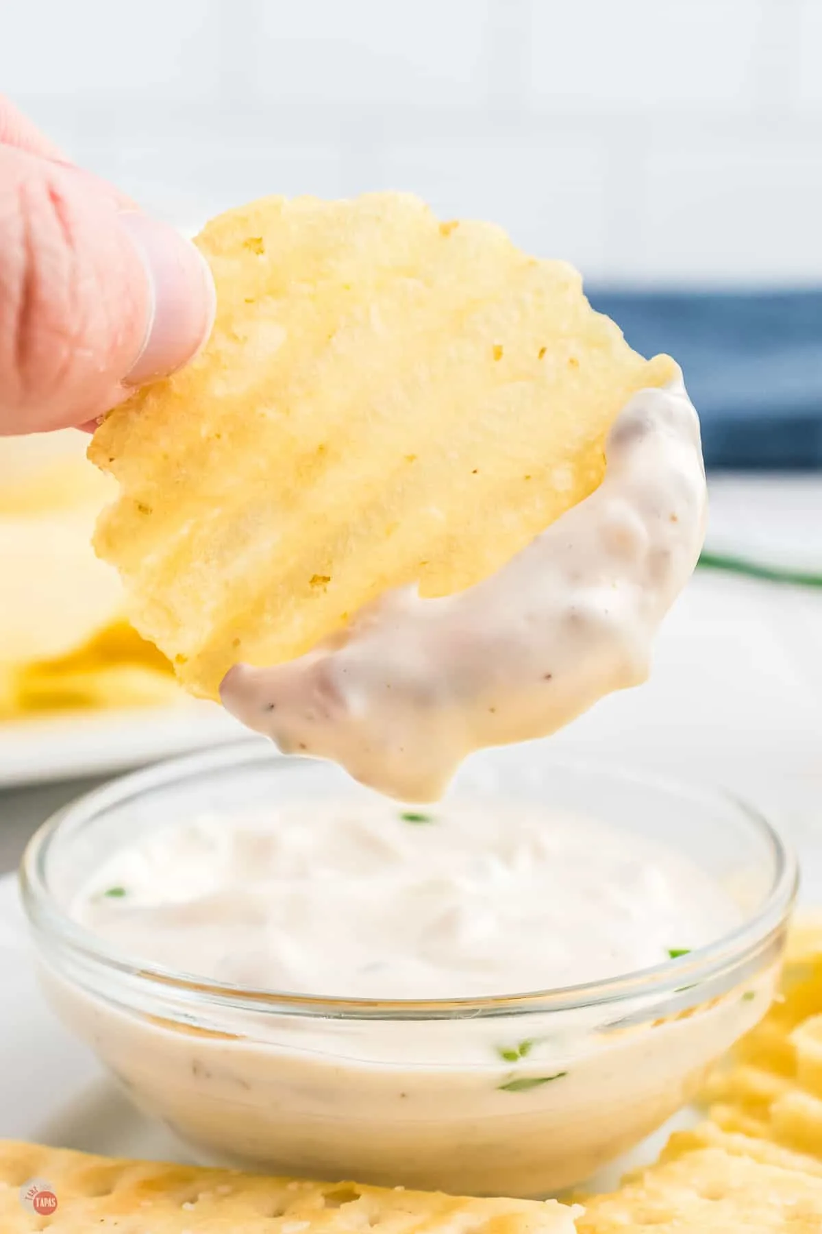 chip dipping into dip