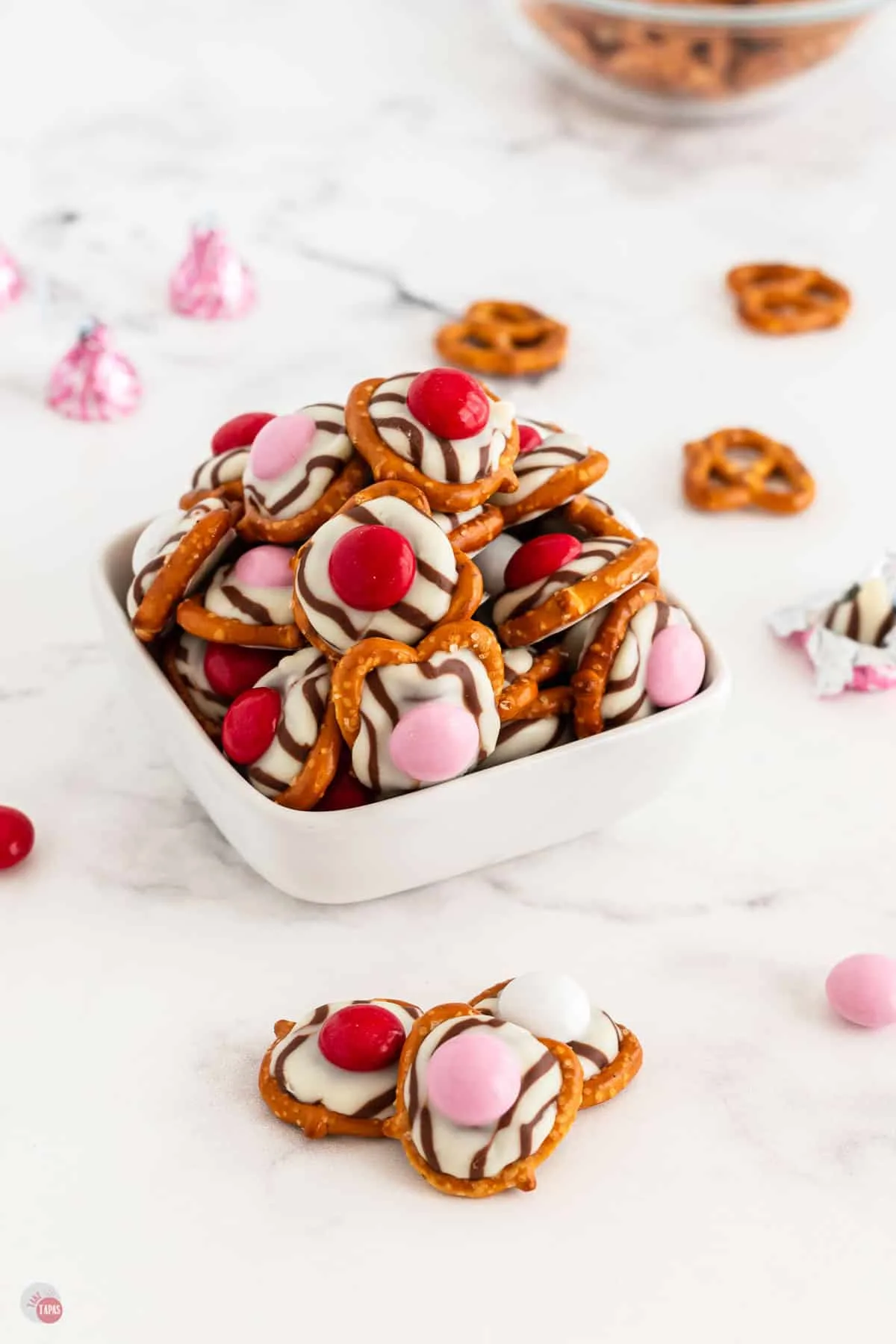 Chocolate cake balls stripped with pink candy melts for Valentines