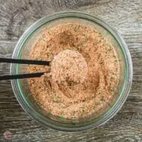 chicken seasoning in a measuring spoon