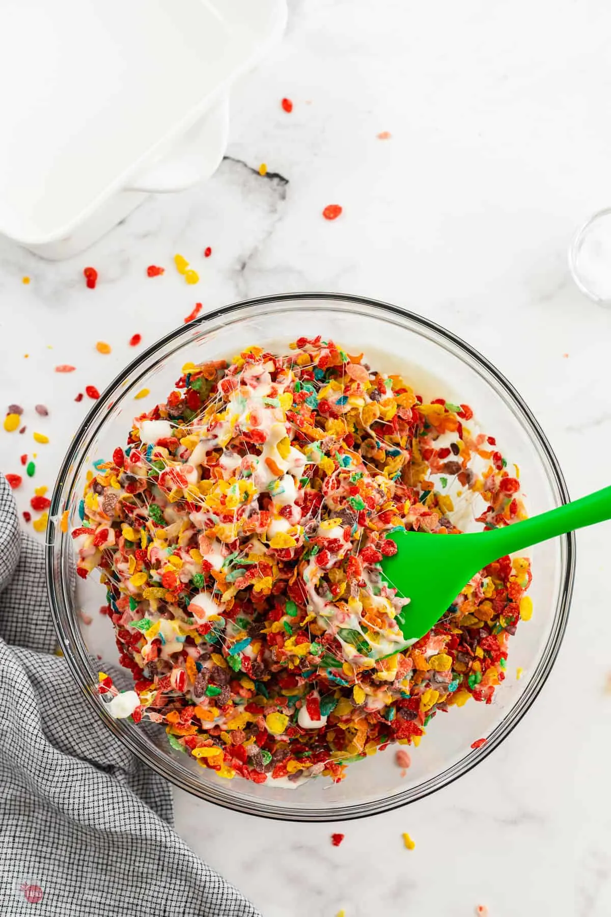 bowl of fruity pebbles treats being mixed