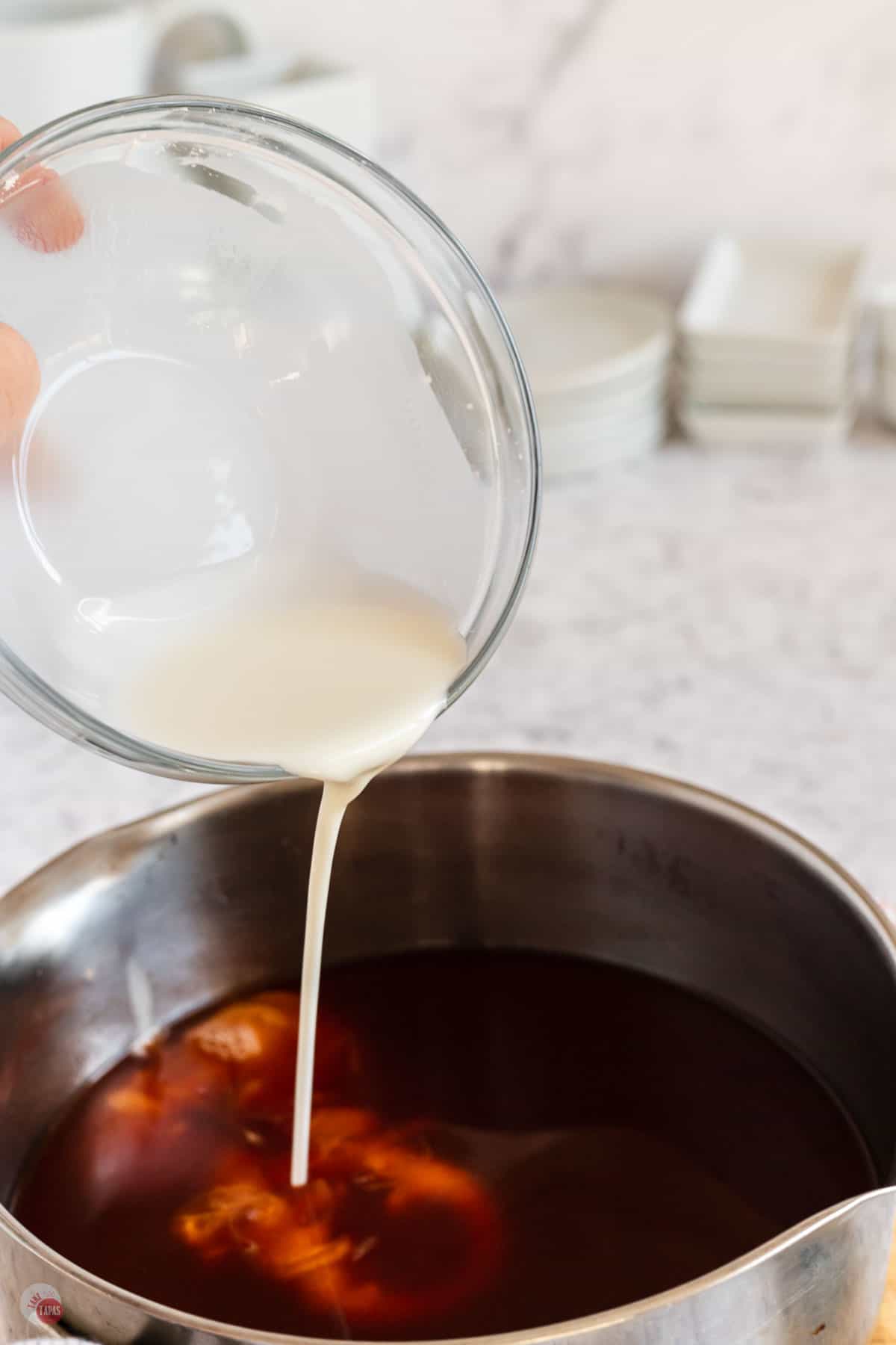 cornstarch pouring into pan