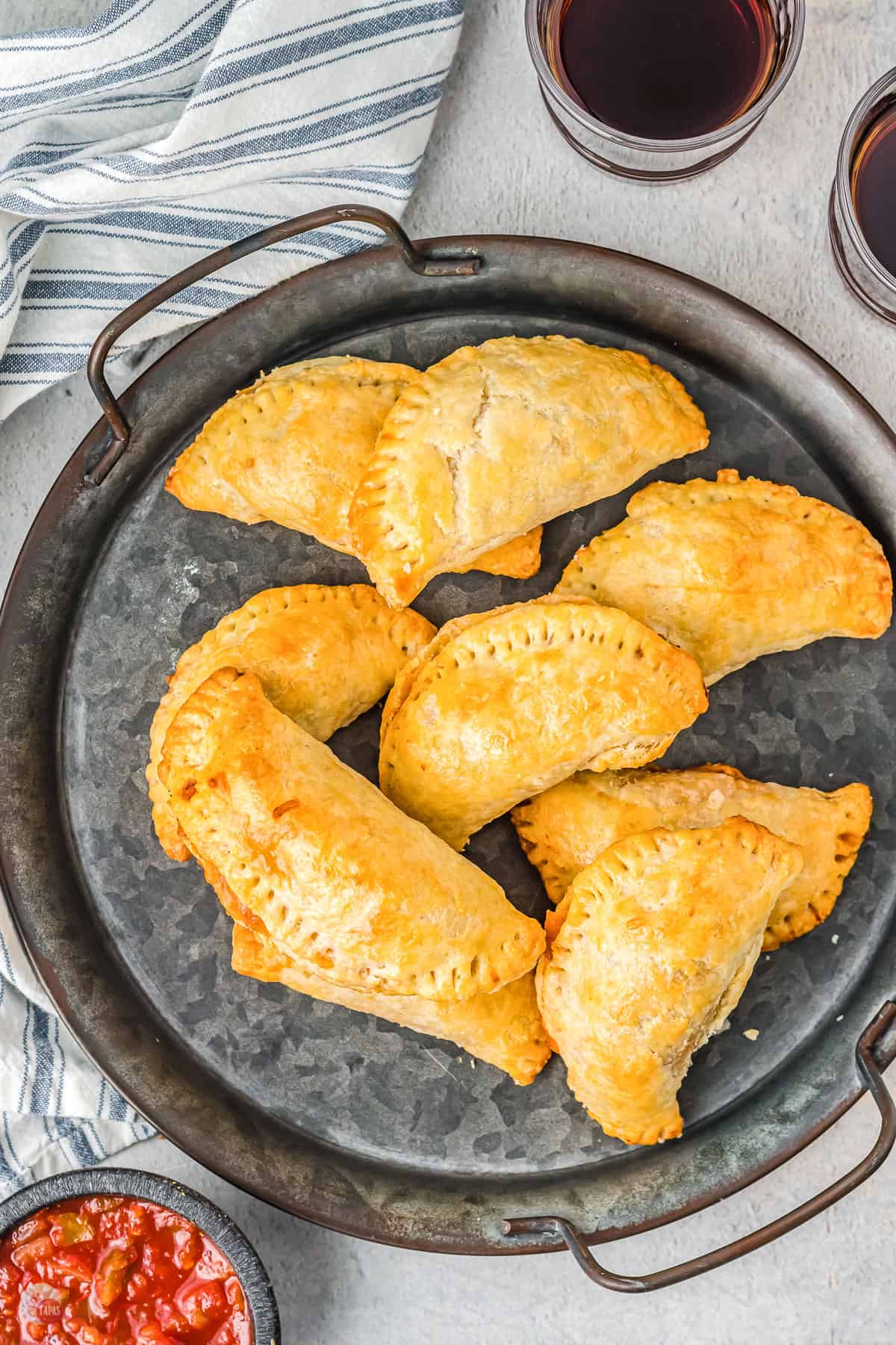 silver tray of taco empanadas