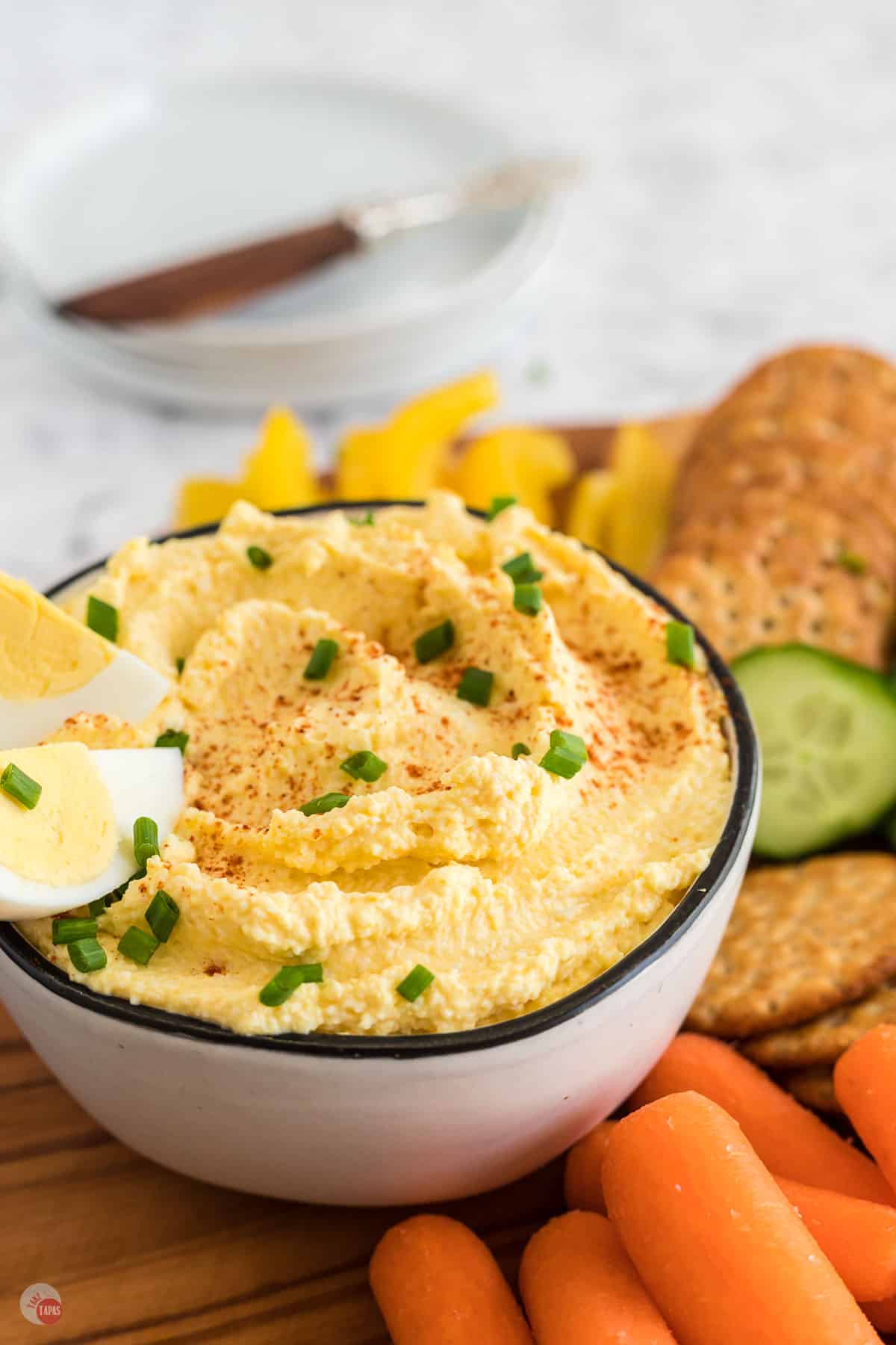 bowl of dip with veggies