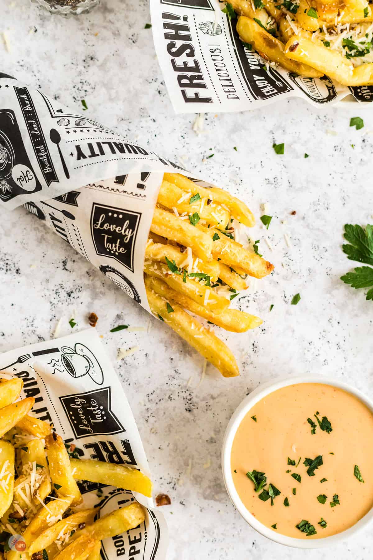 cone of fries with dipping sauce