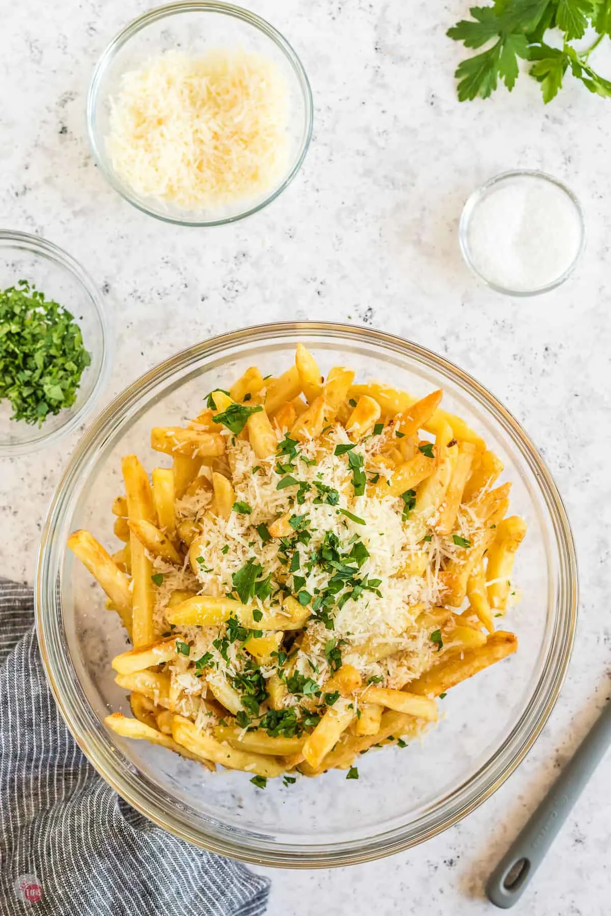 bowl of french fries with garlic and parmesan