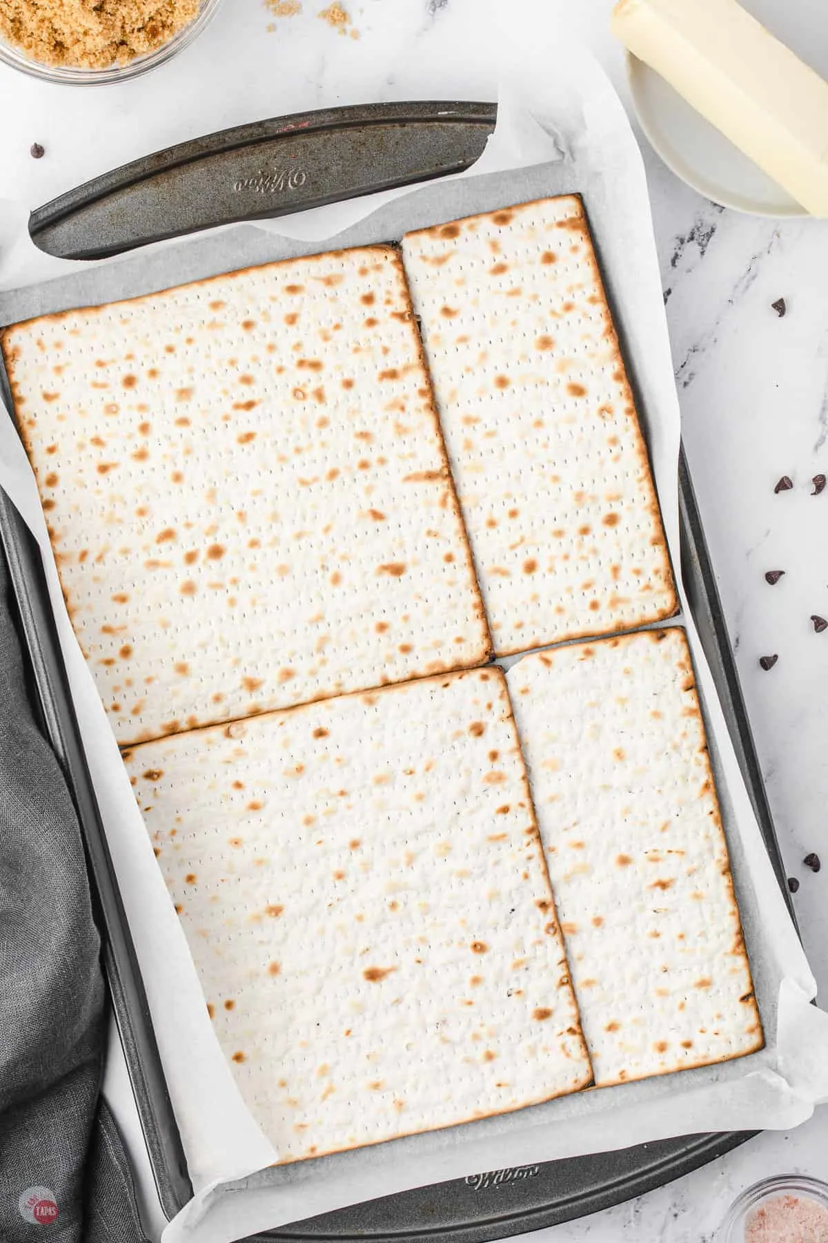 make a single layer of matzo on a sheet of parchment paper