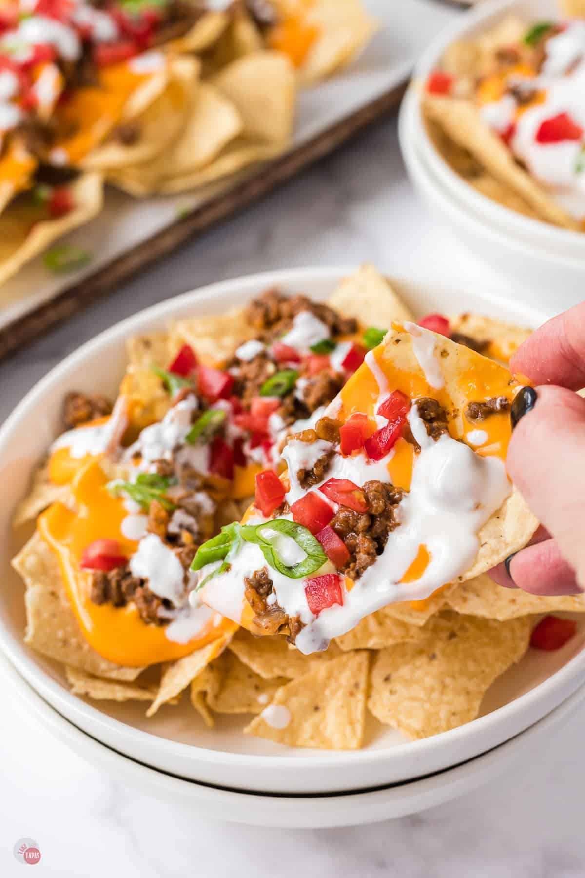 nachos supreme in white dish