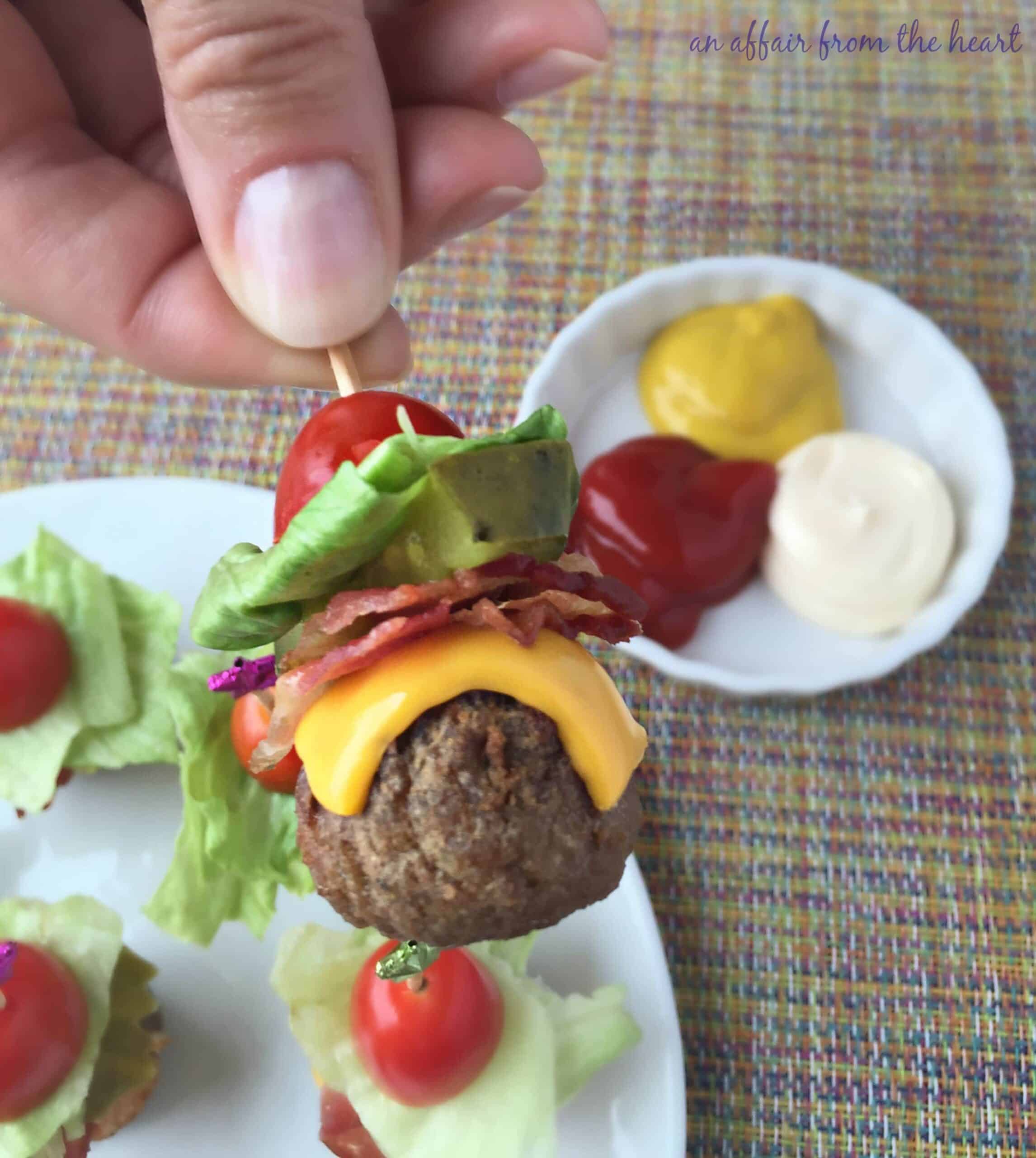 mini cheeseburger meatballs on a toothpick