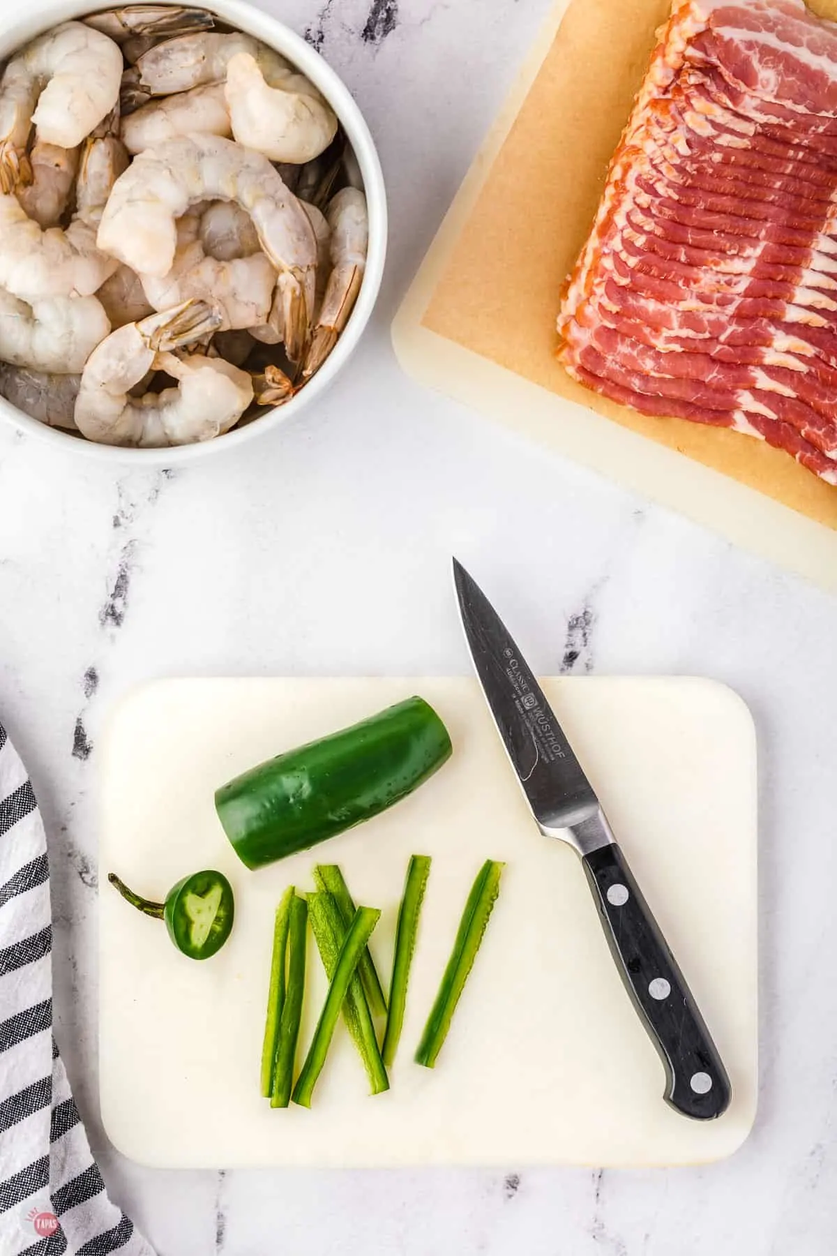 sliced jalapeno on a cutting board