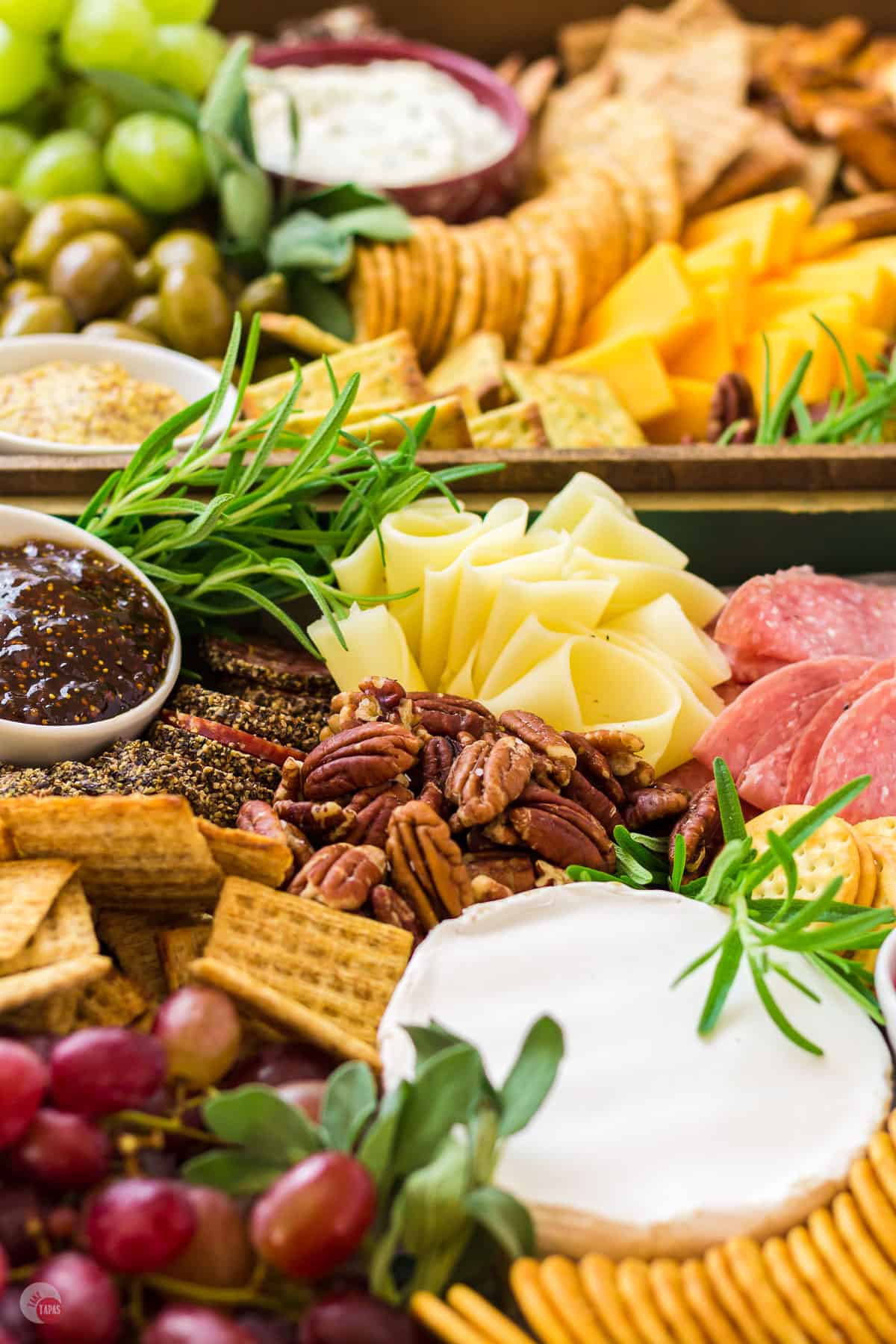 close up of pecans on a cheese board