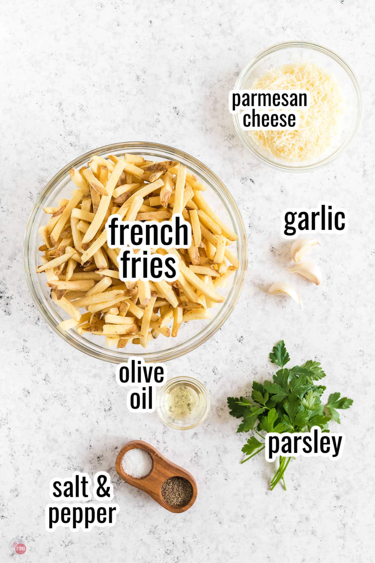 ingredients for a french fry recipe with text overlay labeling them