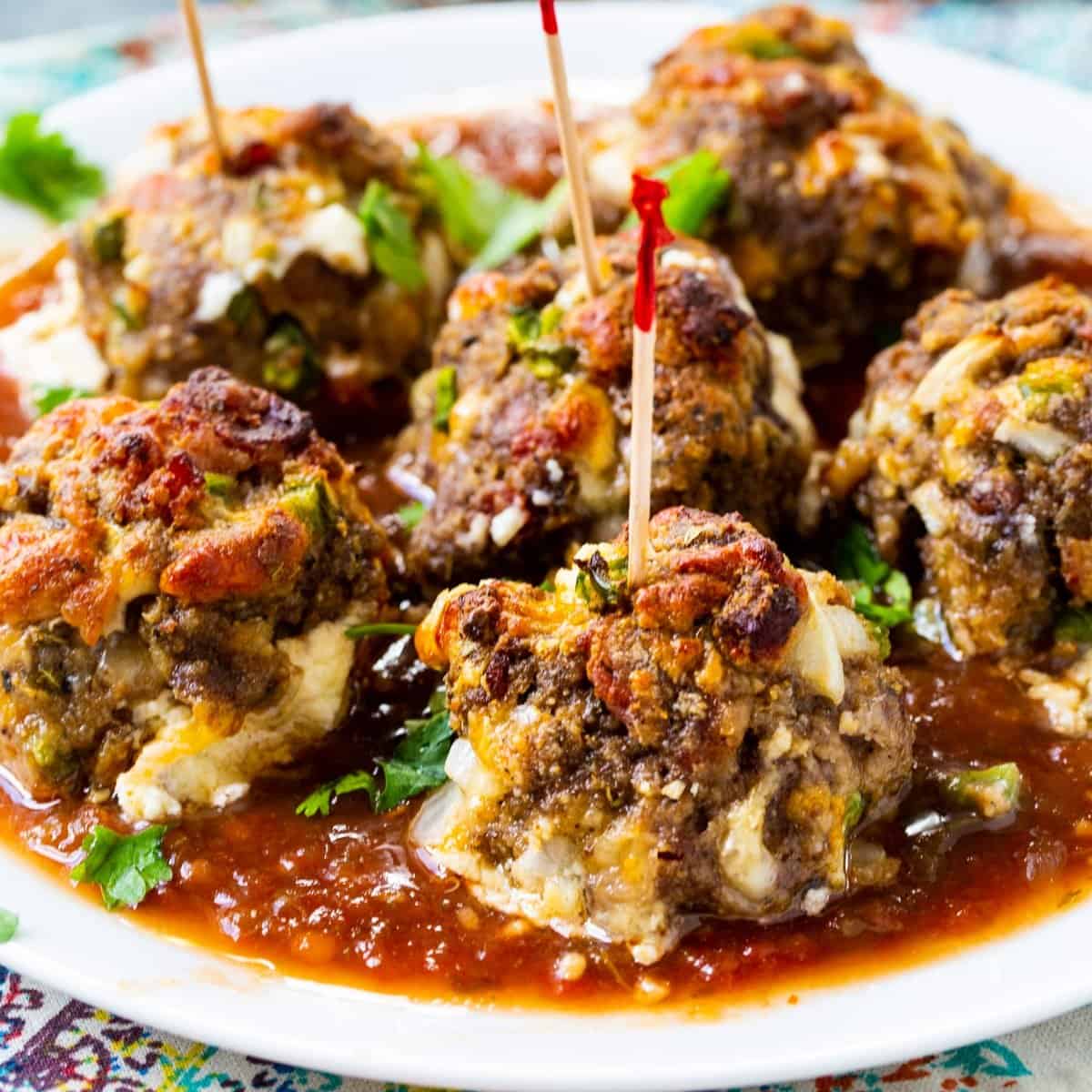 jalapeno popper meatballs with red toothpicks