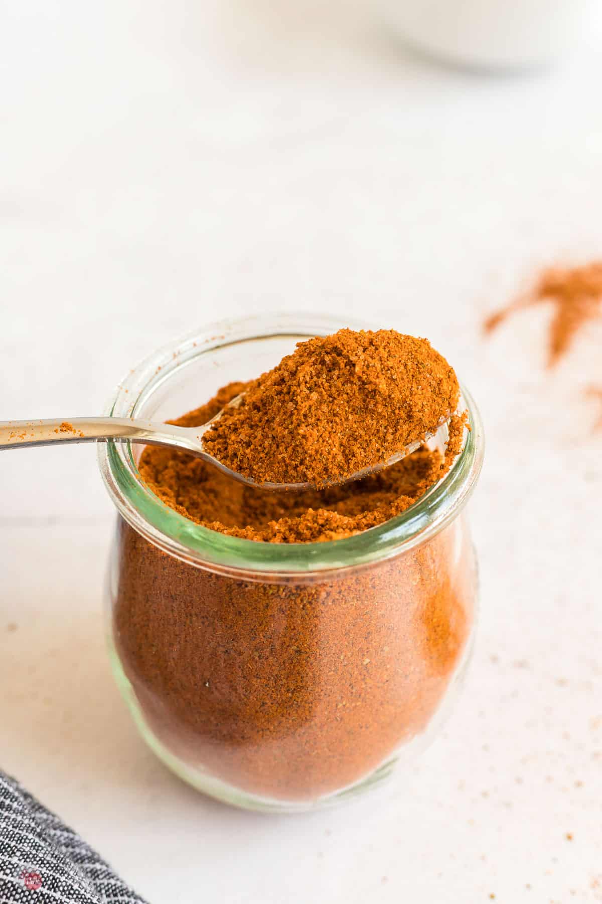 jar of seasoning with spoon