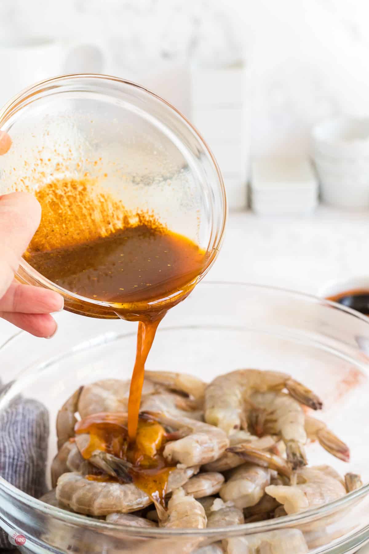 butter pouring over a bowl of shrimp