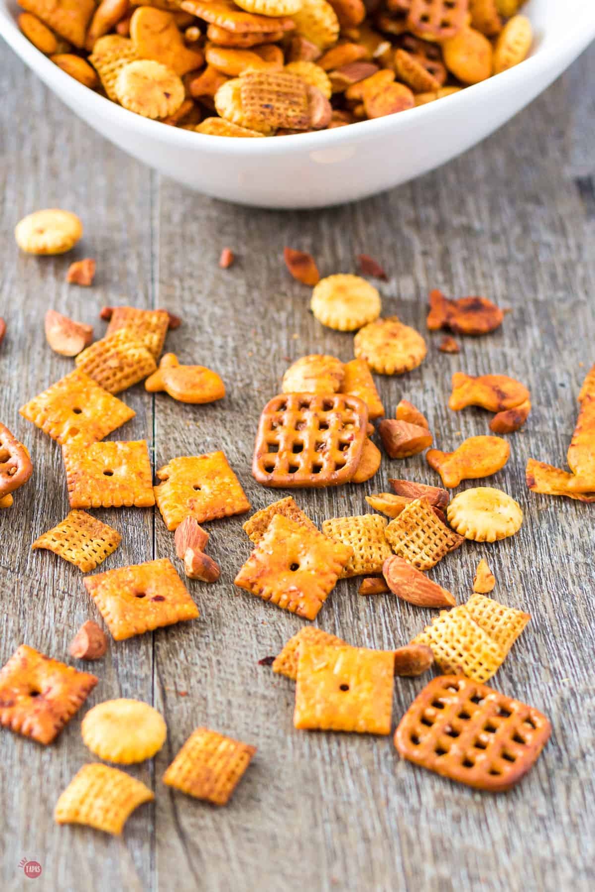 mixture of chex cereal with other crackers on a table