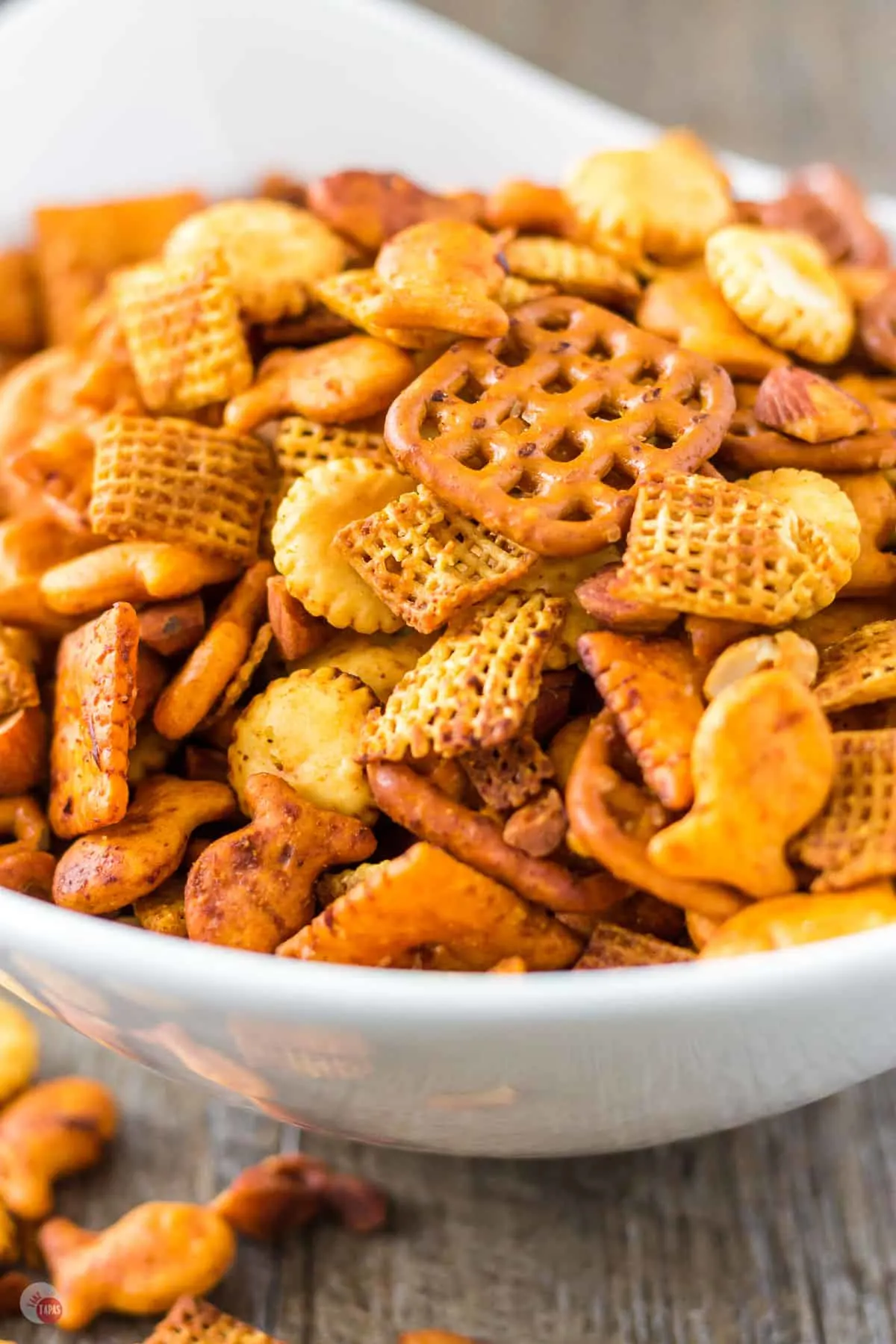 close up of chex mix in a white bowl