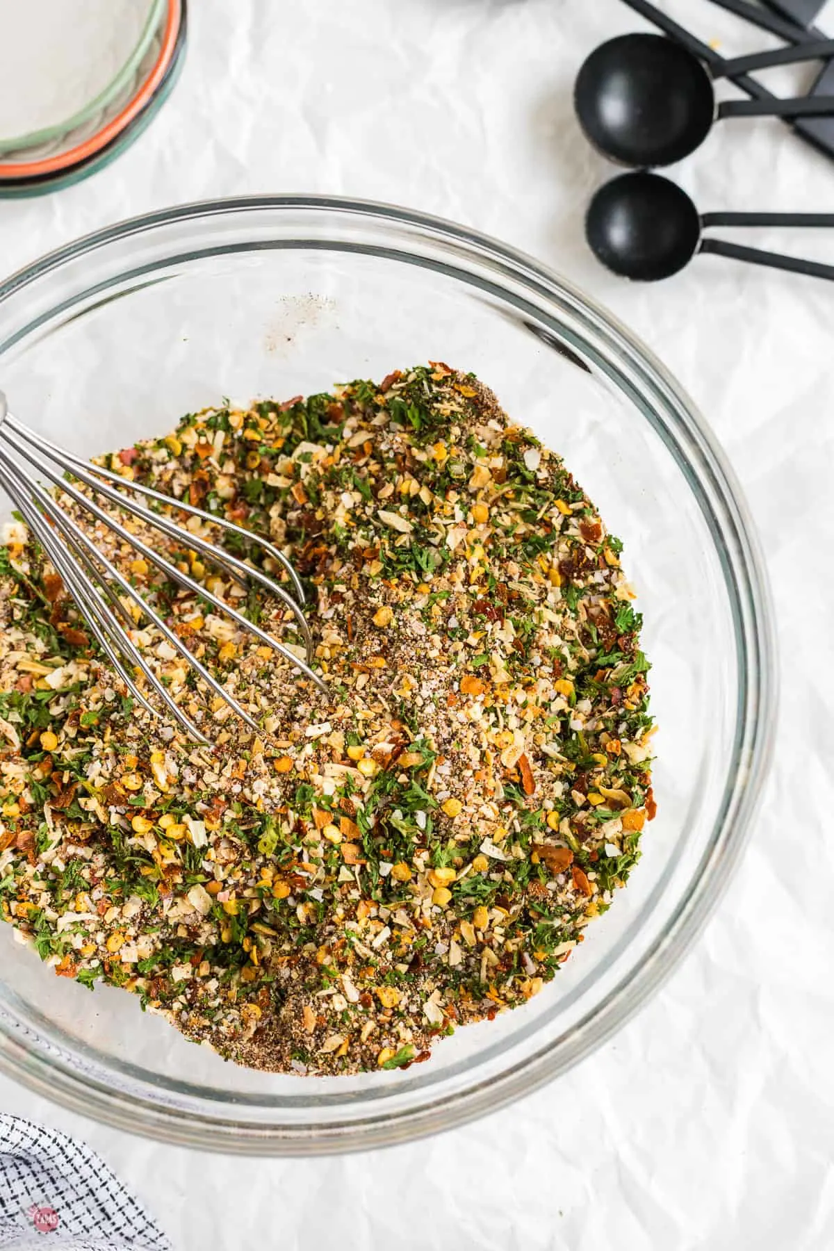 bowl of steak seasoning with a whisk