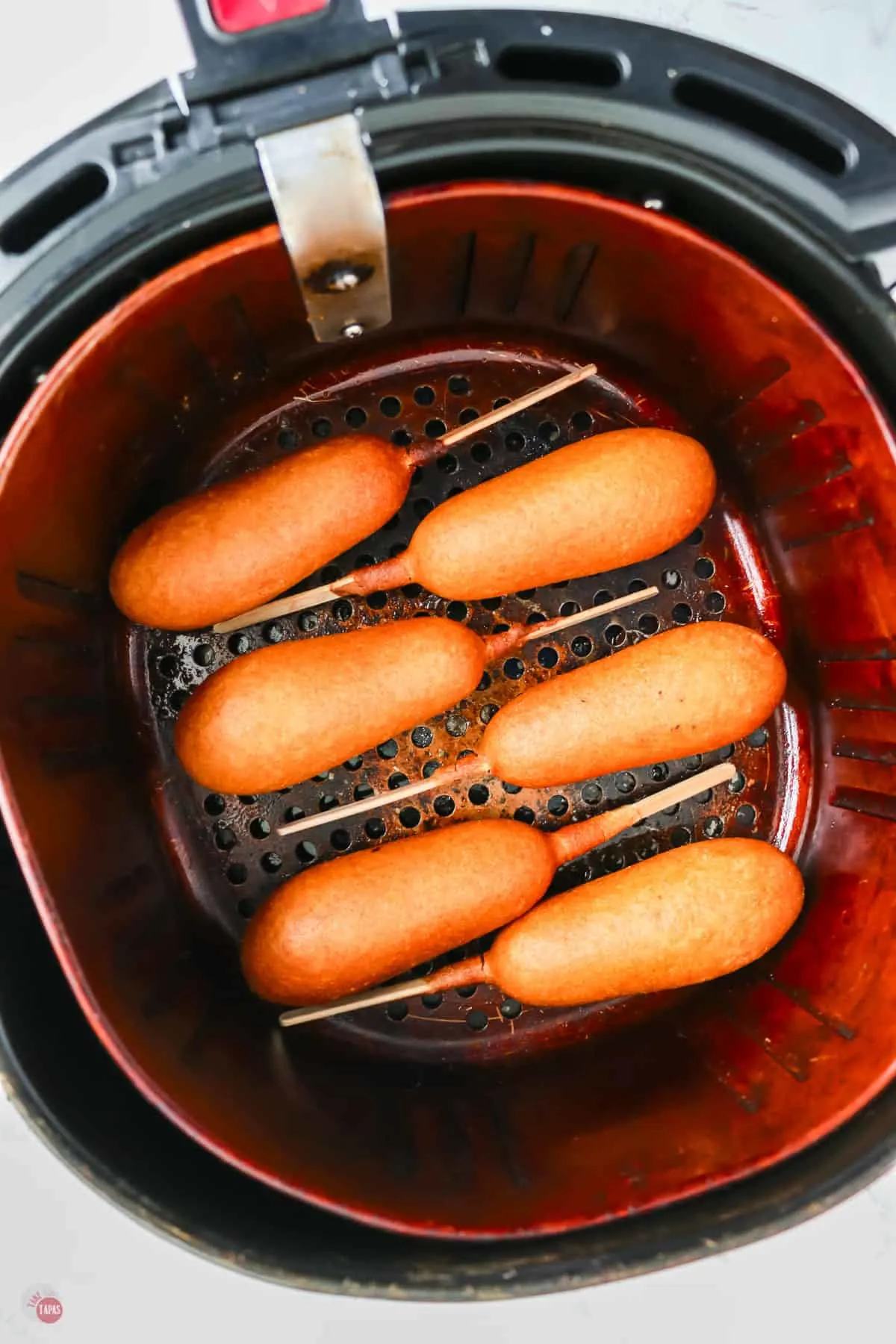 Corndogs in an air fryer. 