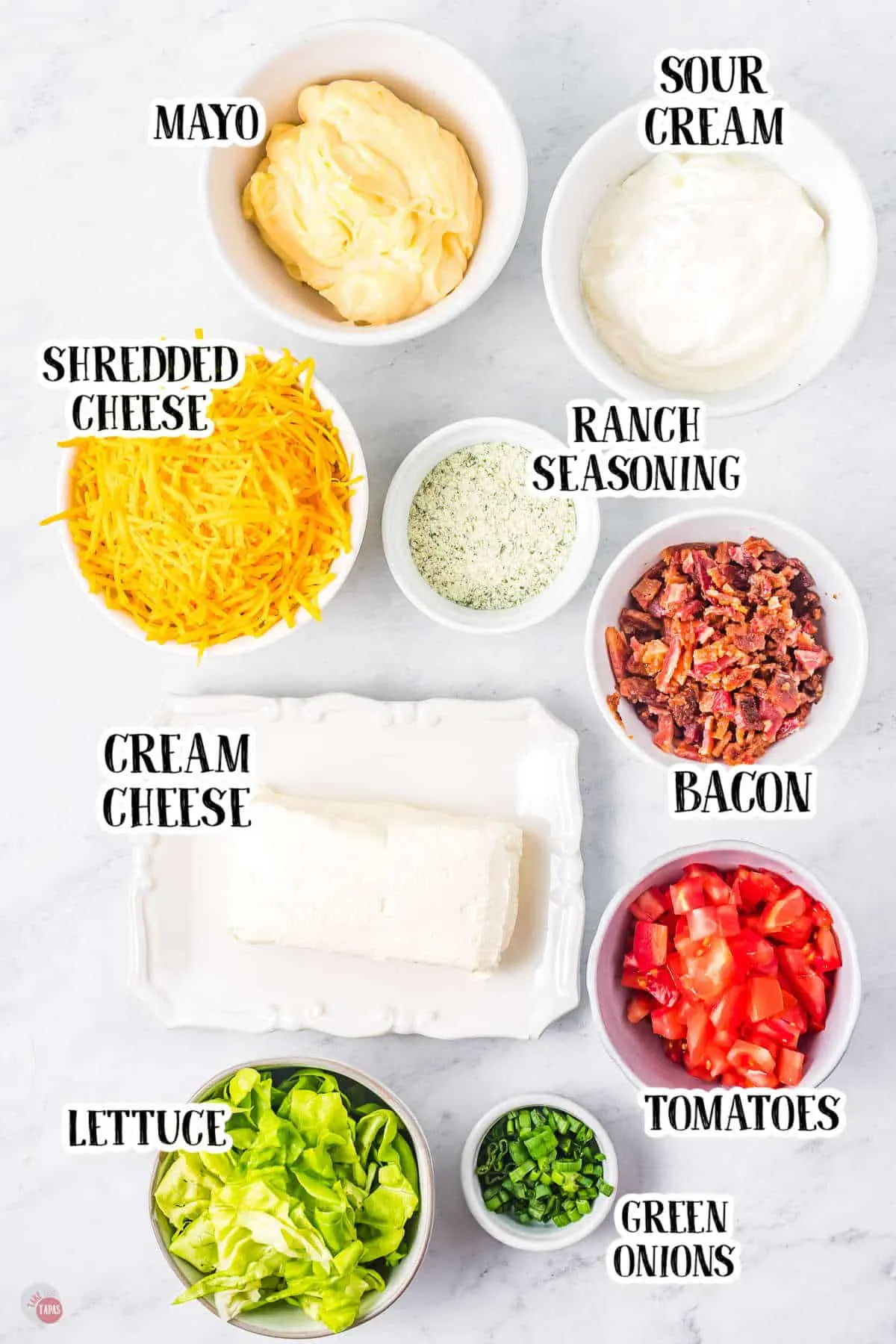 Ingredients for BLT Dip all in small white bowls.