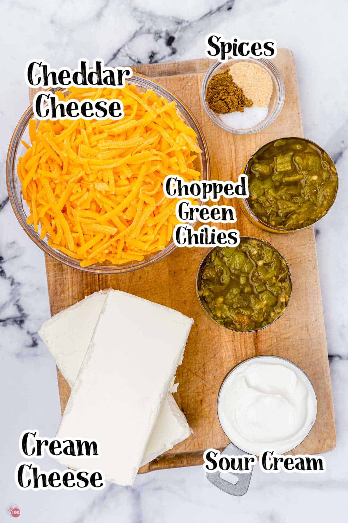 labeled picture of individual green chile dip ingredients on a marble surface