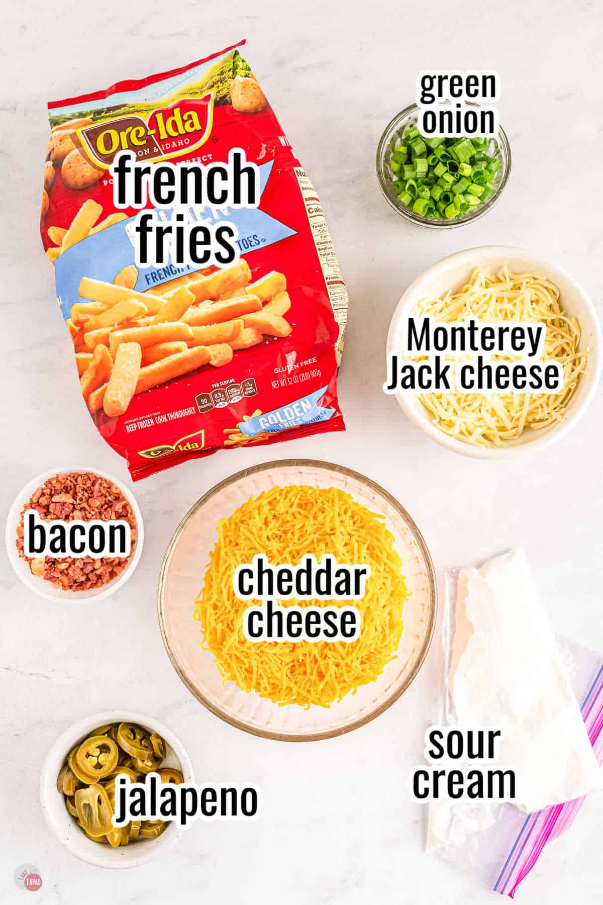 ingredients for loaded fries with text overlay labeling them