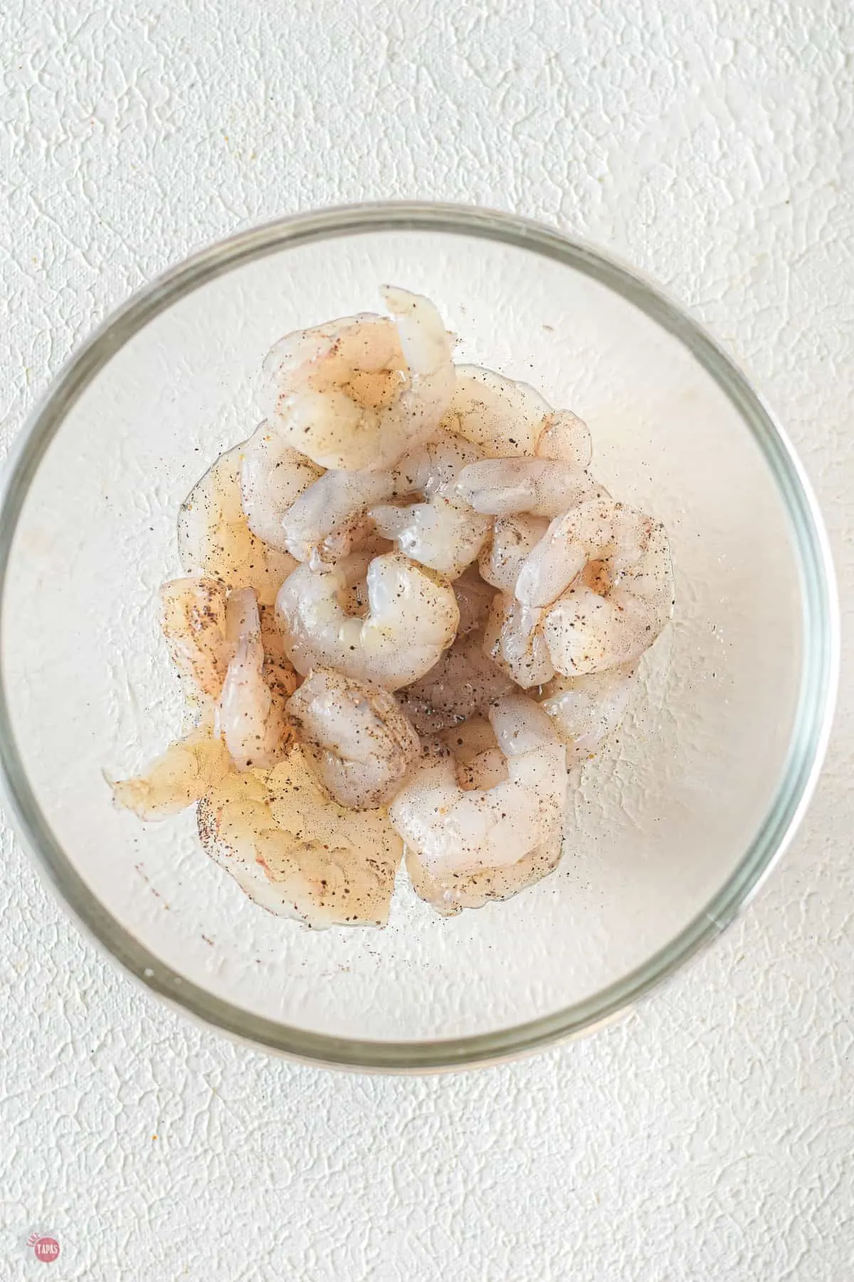 bowl of raw shrimp with spices