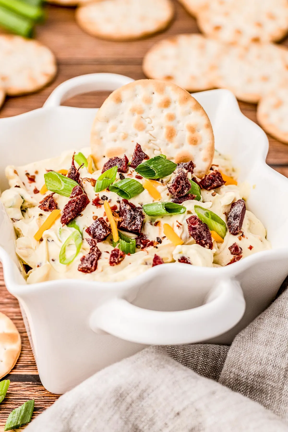 bowl of dip with a cracker