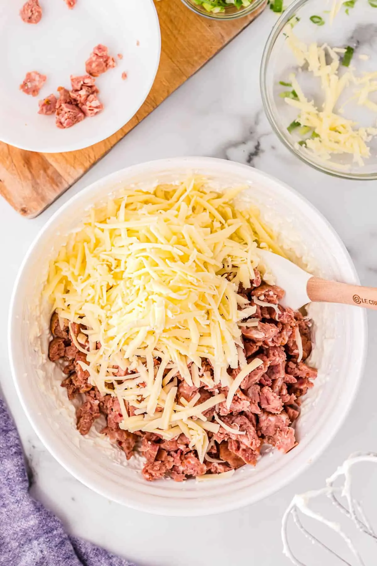 shredded cheese and sausage in a bowl