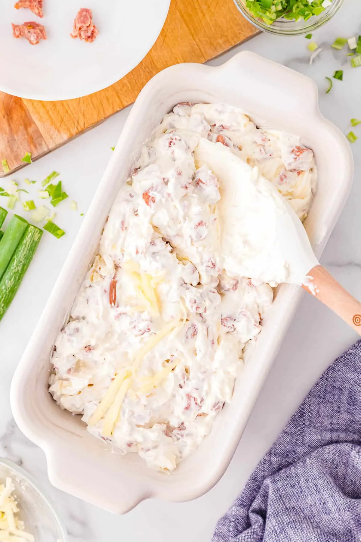 dip being spread into a rectangle casserole dish