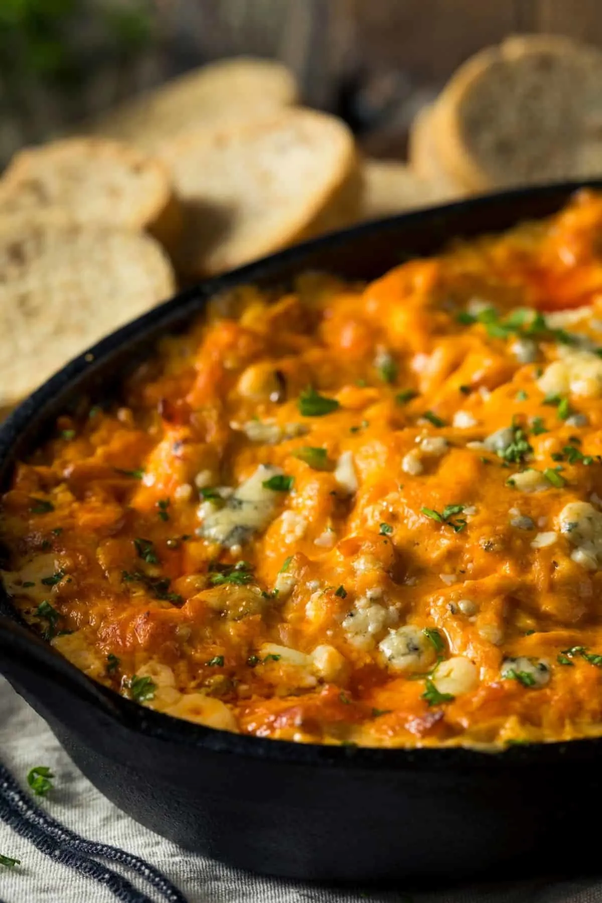 close up shot of buffalo dip in a cast iron pan