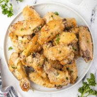 pile of chicken wings on a white plate